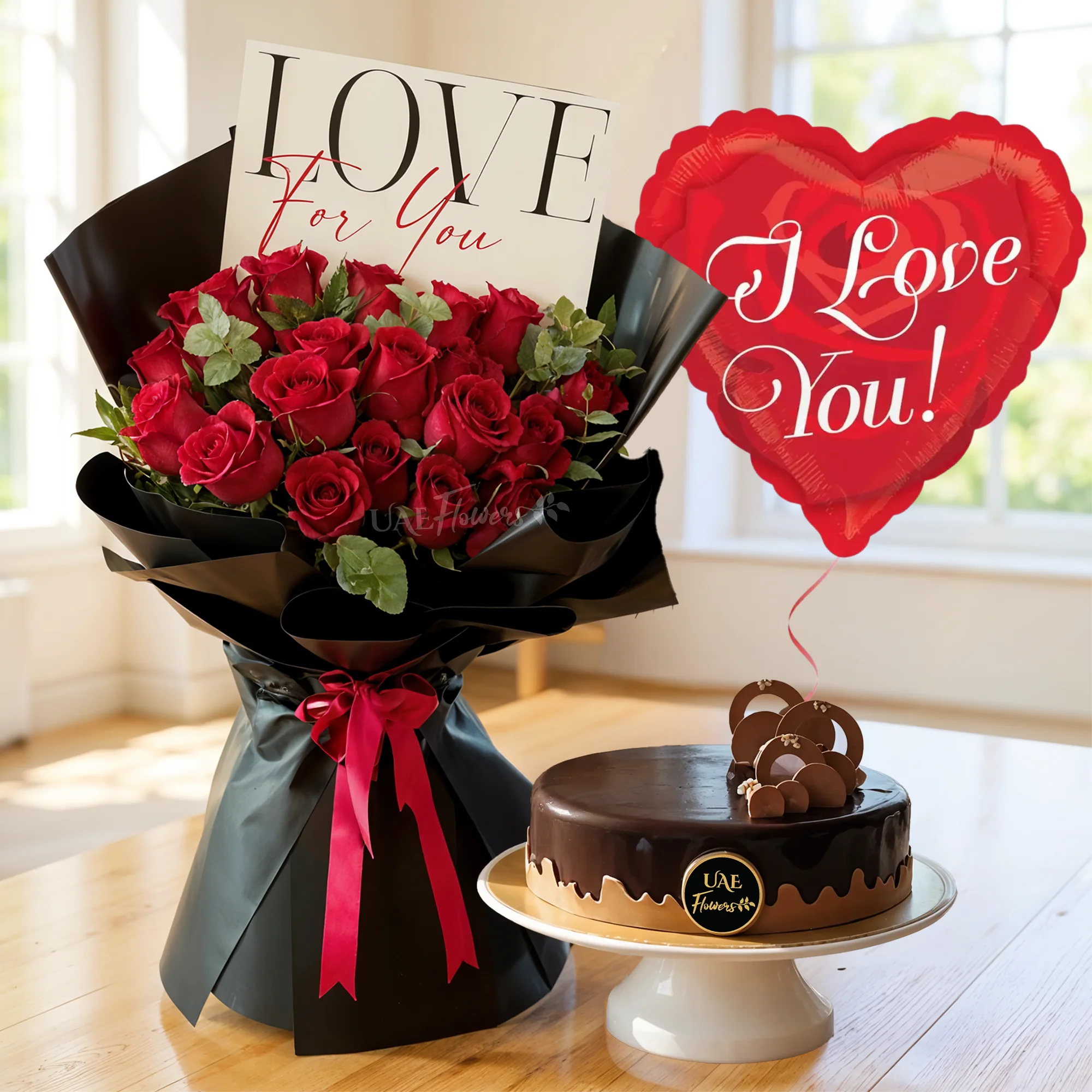 20 red roses with green fillers in black wrapping tied with red ribbons and 1 kg chocolate cake with heart-shaped I LOVE YOU balloon.