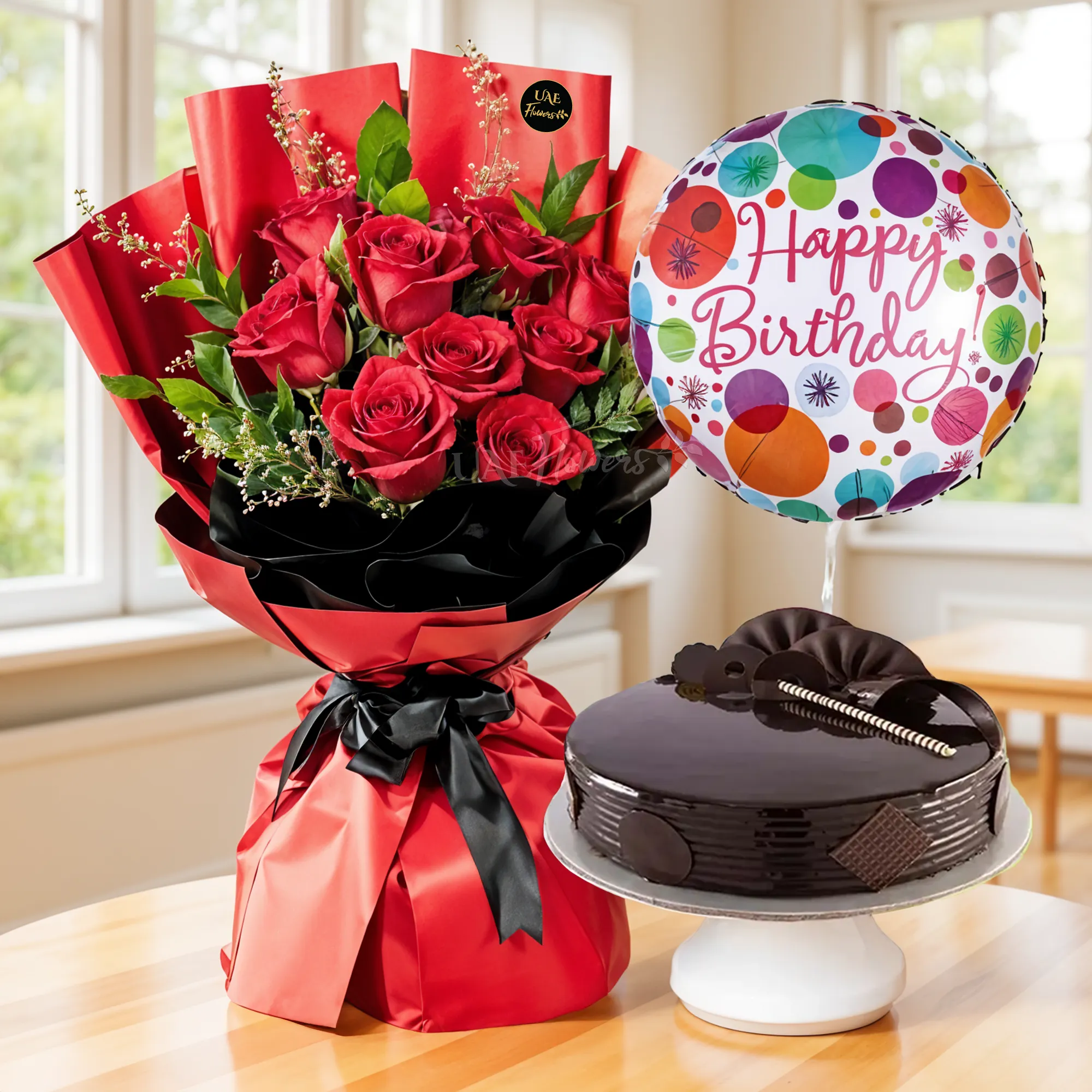 Bouquet of 10 Red Roses with green fillers in nice wrapping with 1 Kg Chocolate Cake and HAPPY BIRTHDAY Foil Balloon.