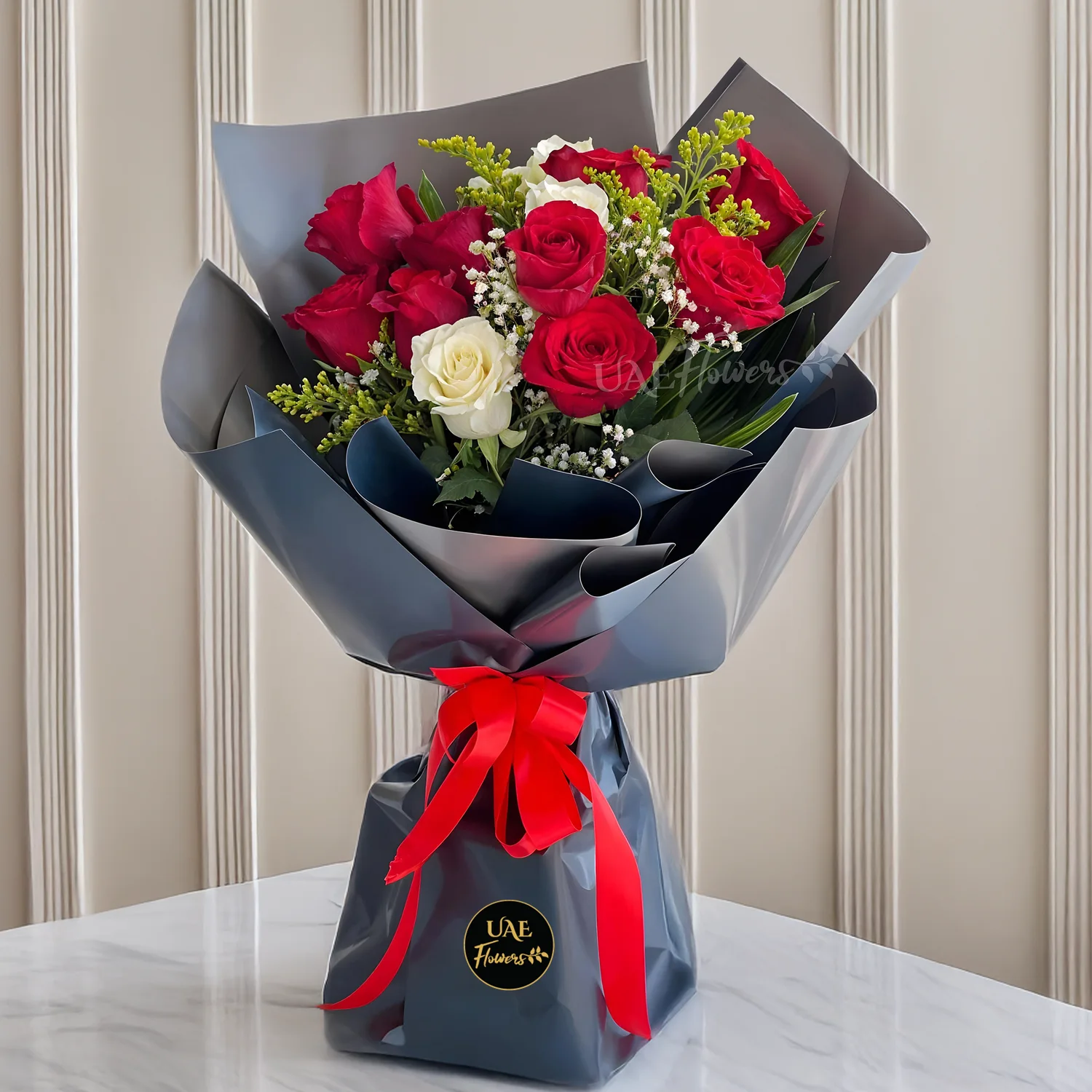 Bouquet of 9 red roses and 3 white roses with green fillers in nice wrapping with a small teddy bear and HAPPY BIRTHDAY foil balloon.