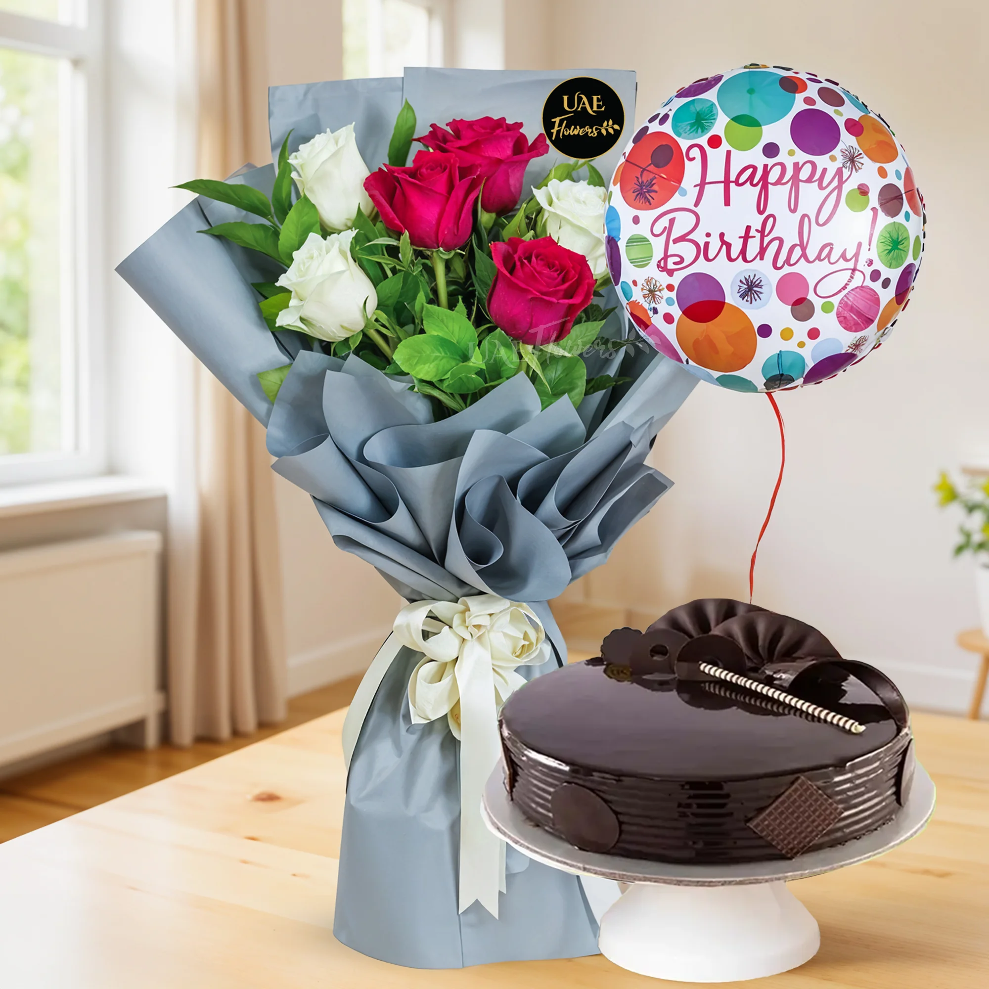 Bouquet of 6 red & white roses with green fillers in paper packing, Happy birthday foil balloon and 1 kg chocolate cake.