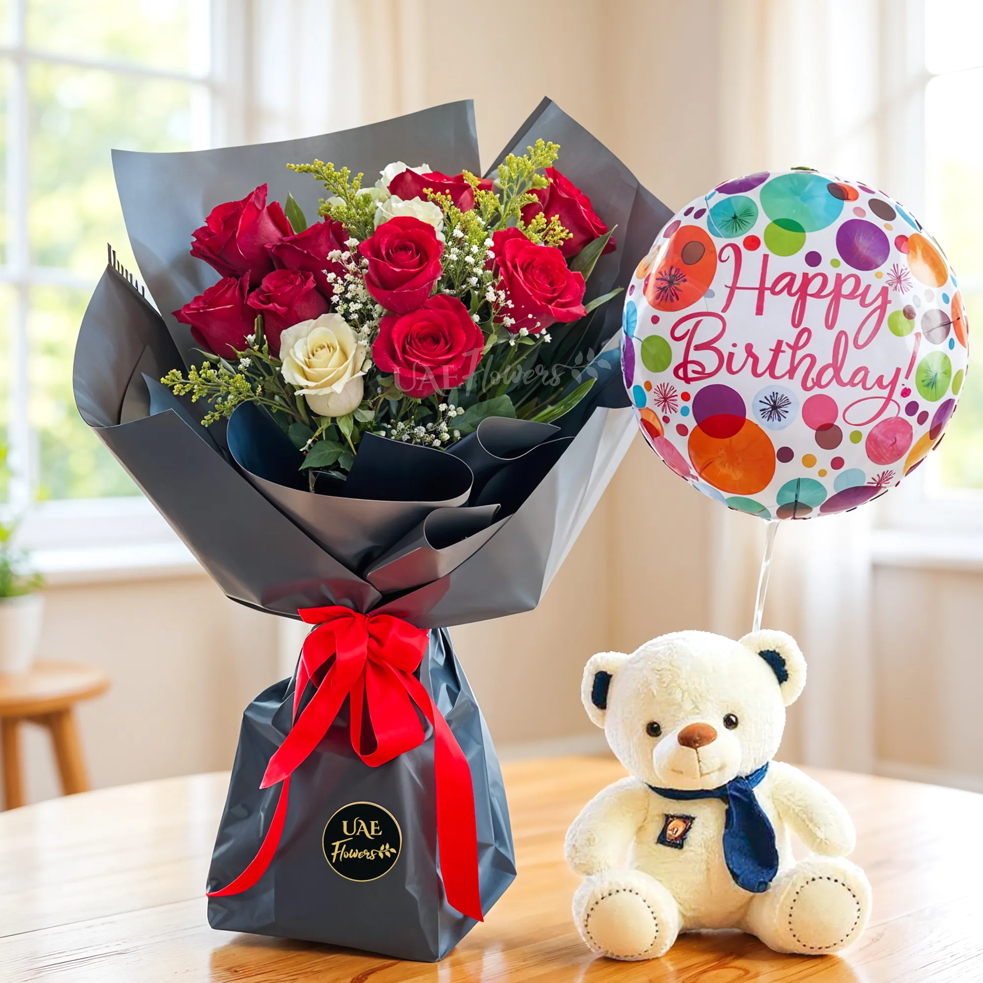 Bouquet of 9 red roses and 3 white roses with green fillers in nice wrapping with a small teddy bear and HAPPY BIRTHDAY foil balloon.