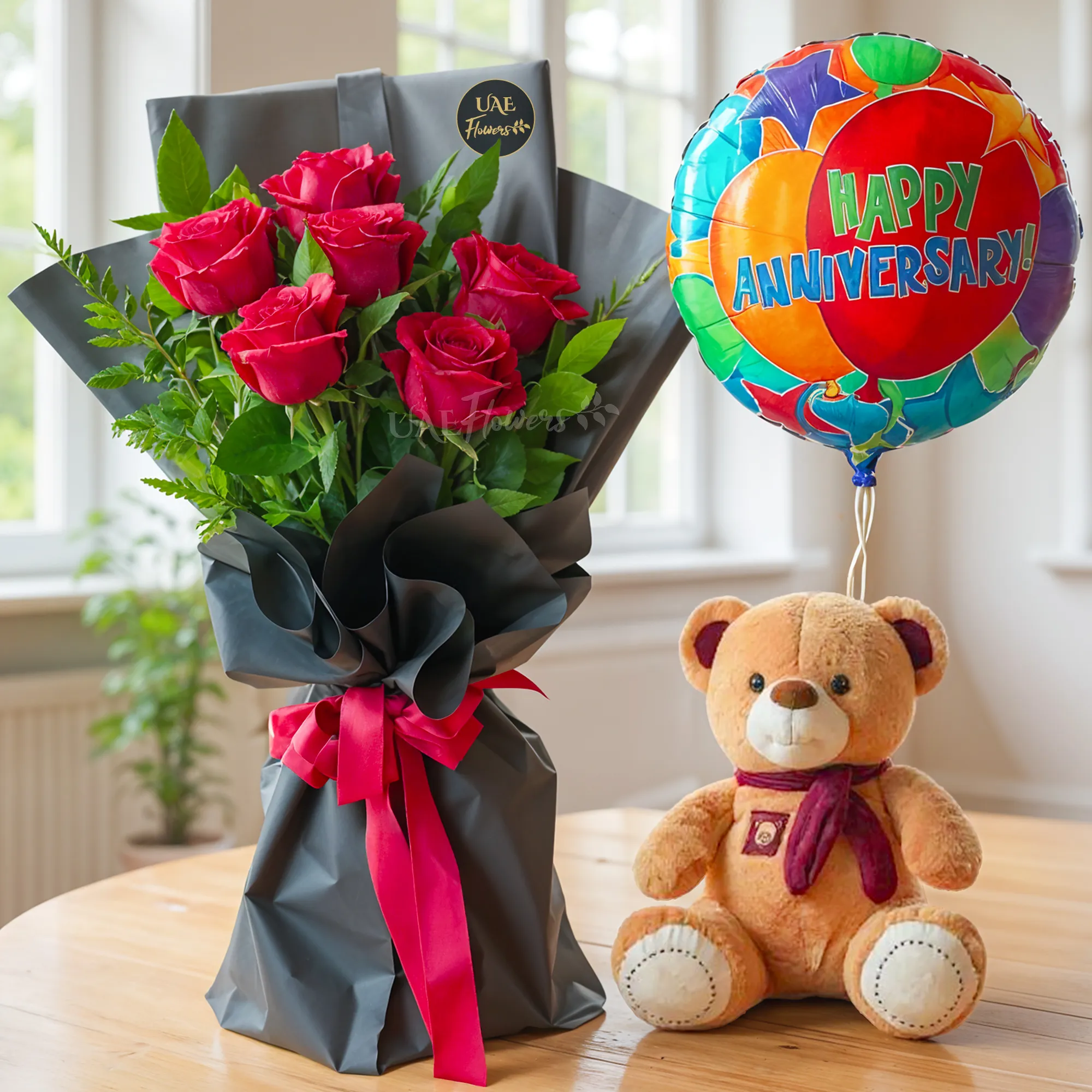 Bouquet of 6 Red roses with green fillers in nice wrapping with a small teddy bear and HAPPY ANNIVERSARY foil balloon.