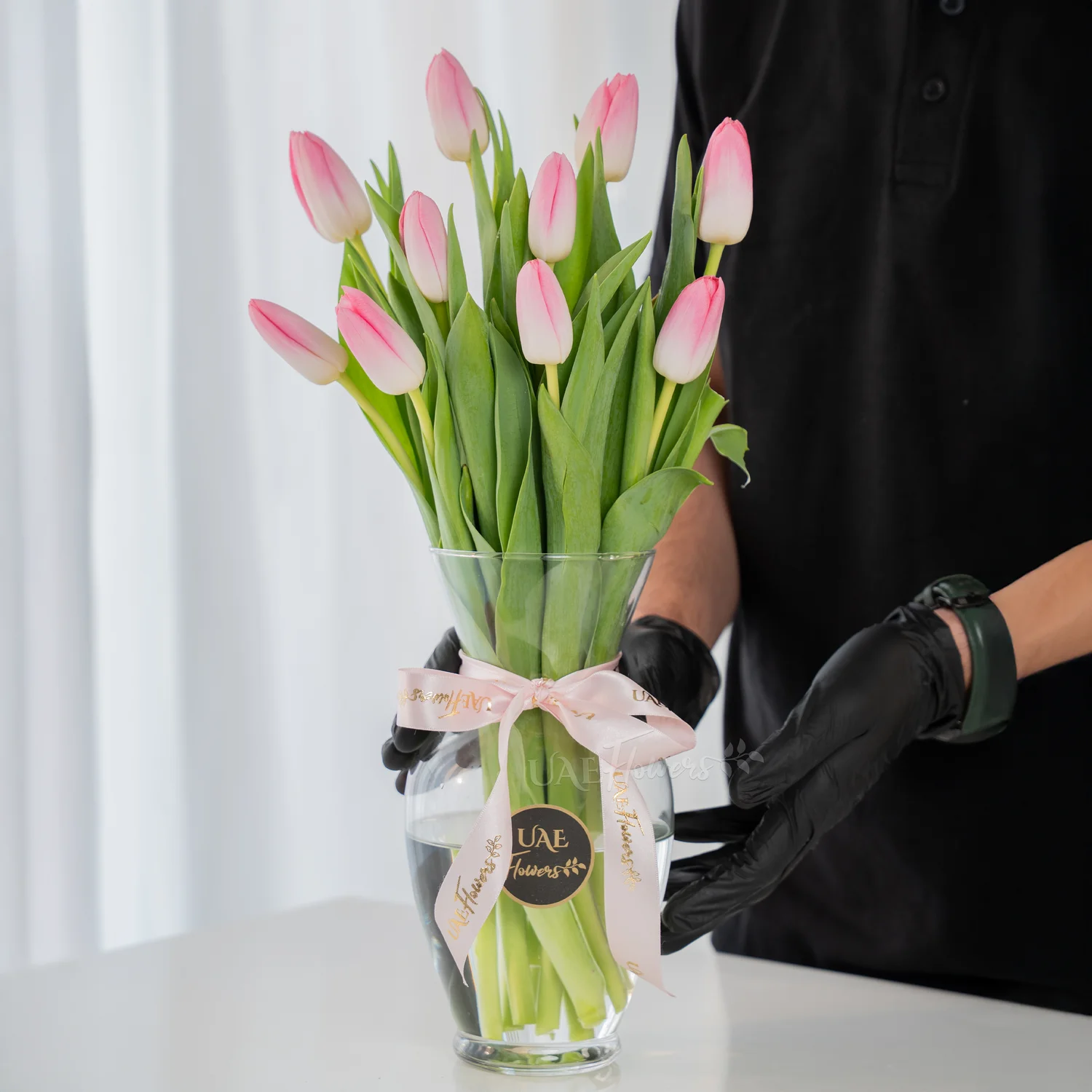 10 pink tulips in a vase, 1 kg chocolate cake and BABY GIRL foil balloon.