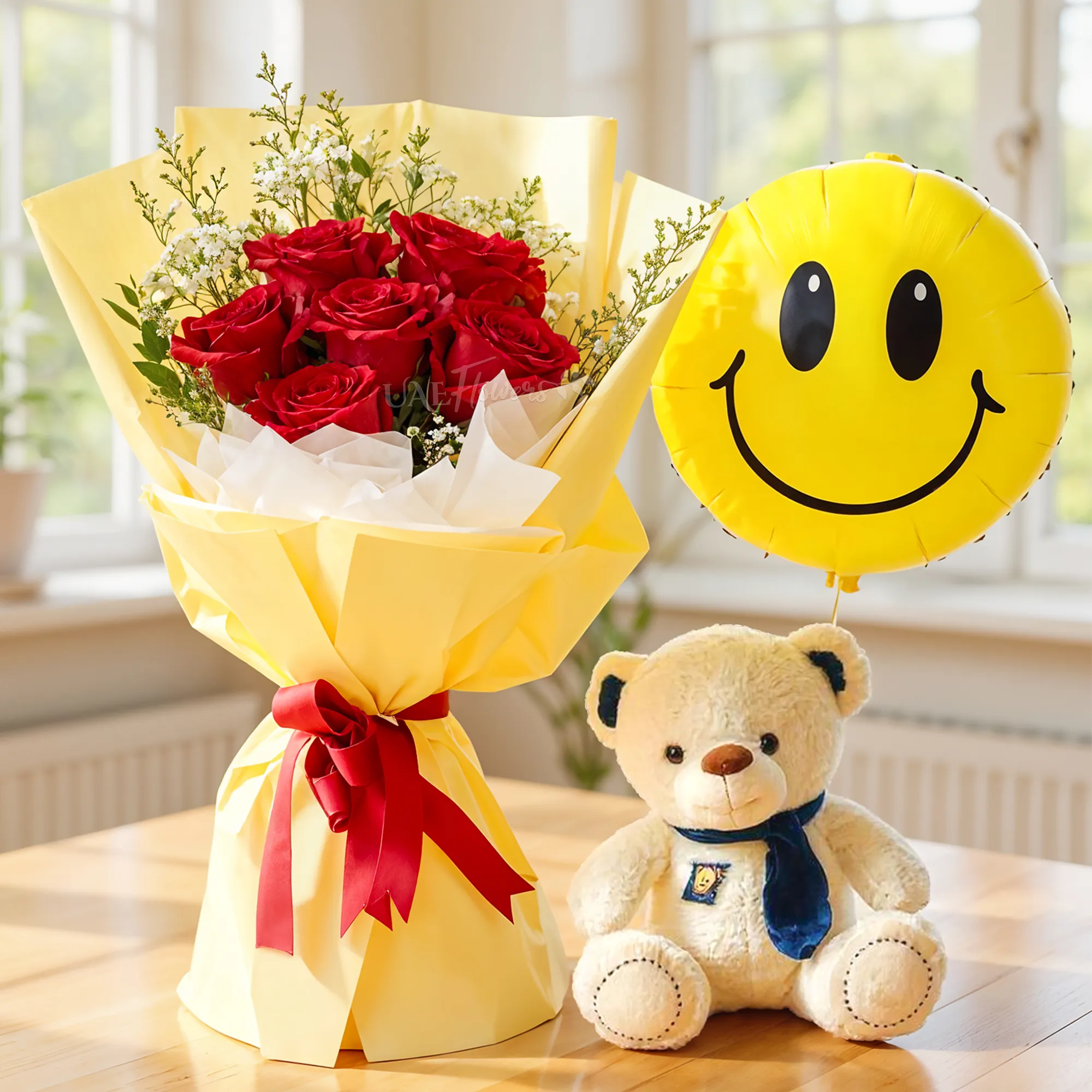 Bouquet of 6 red roses with green fillers in nice wrapping, small teddy bear and SMILEY foil balloon.