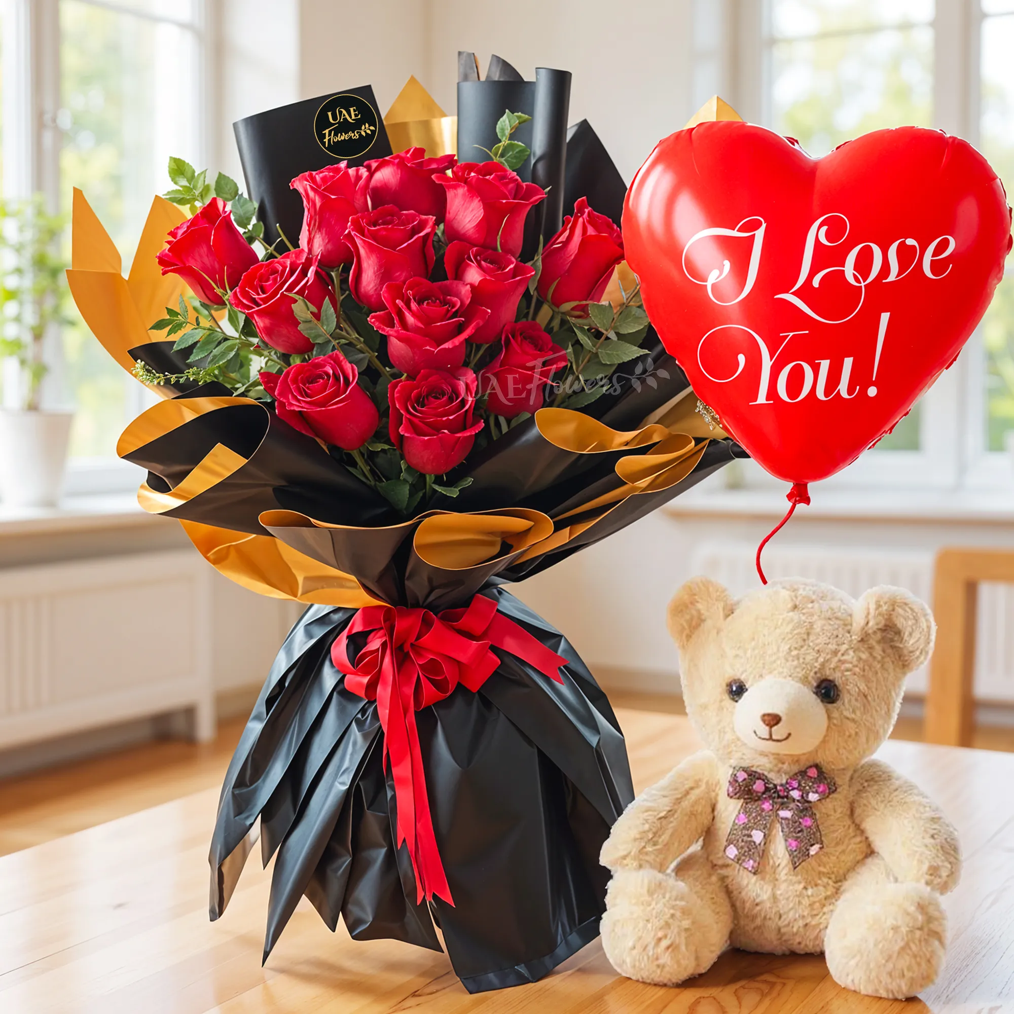 Bouquet of 12 red roses with green fillers in nice wrapping, small teddy bear and heart-shaped I LOVE YOU foil balloon