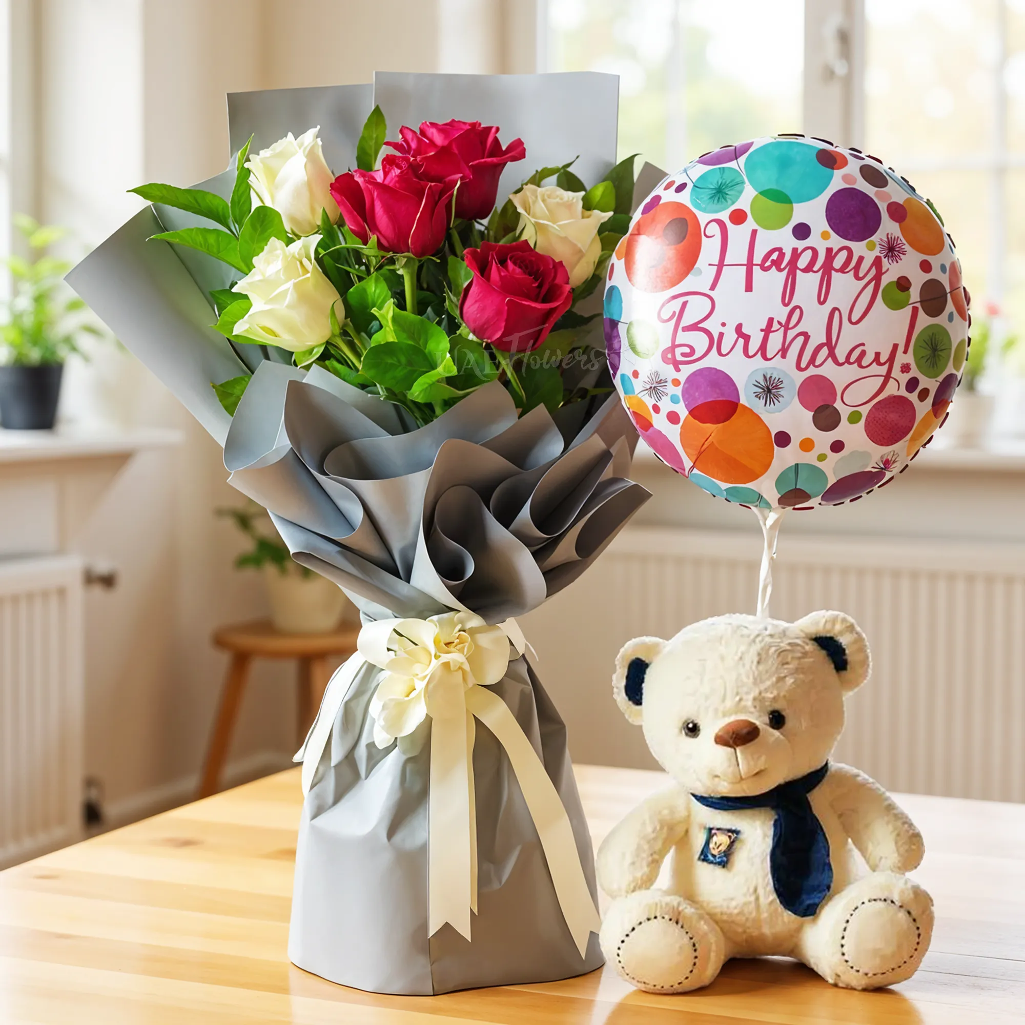 Bouquet of 3 Red roses and 3 White roses with green fillers in nice wrapping with a small teddy bear and HAPPY BIRTHDAY foil balloon.