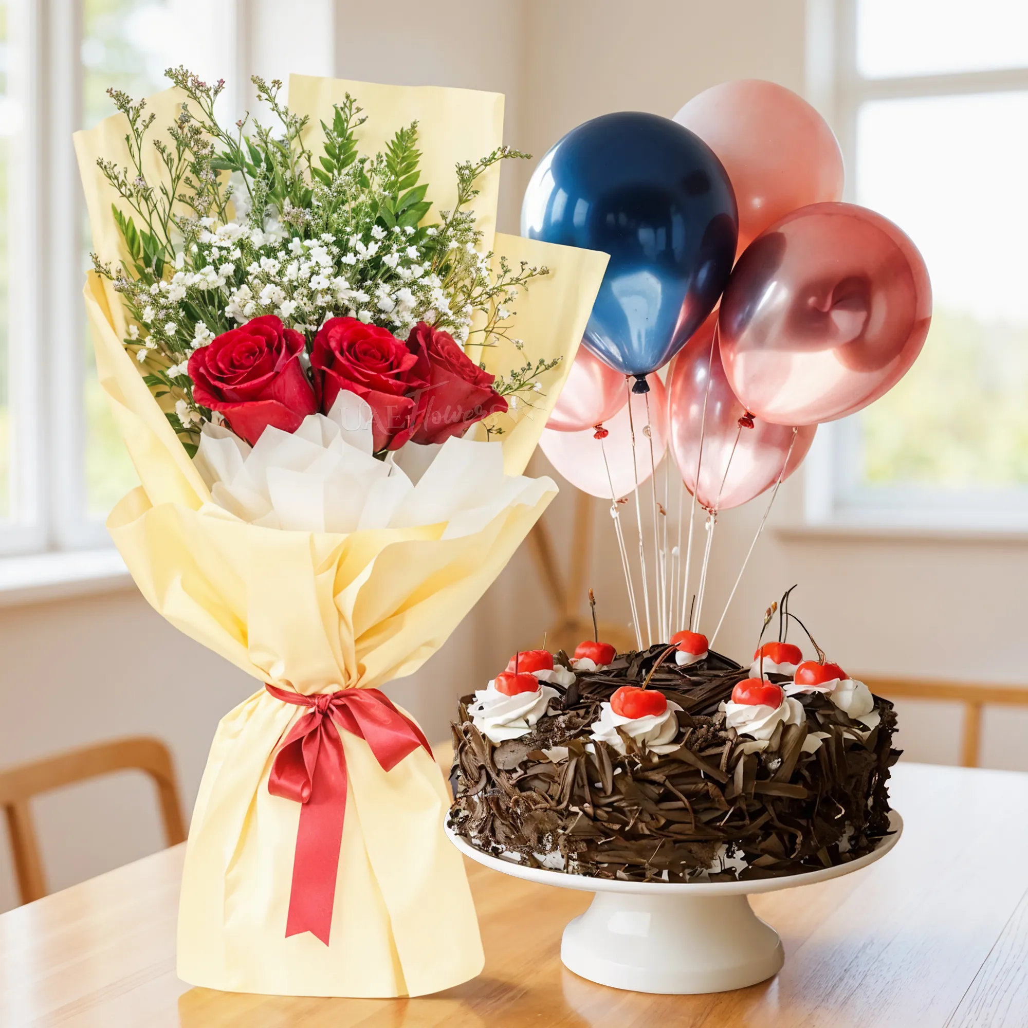 Bouquet of 3 red roses with green & baby's breath fillers in nice wrapping, 1 kg black forest cake with 5 latex balloons.