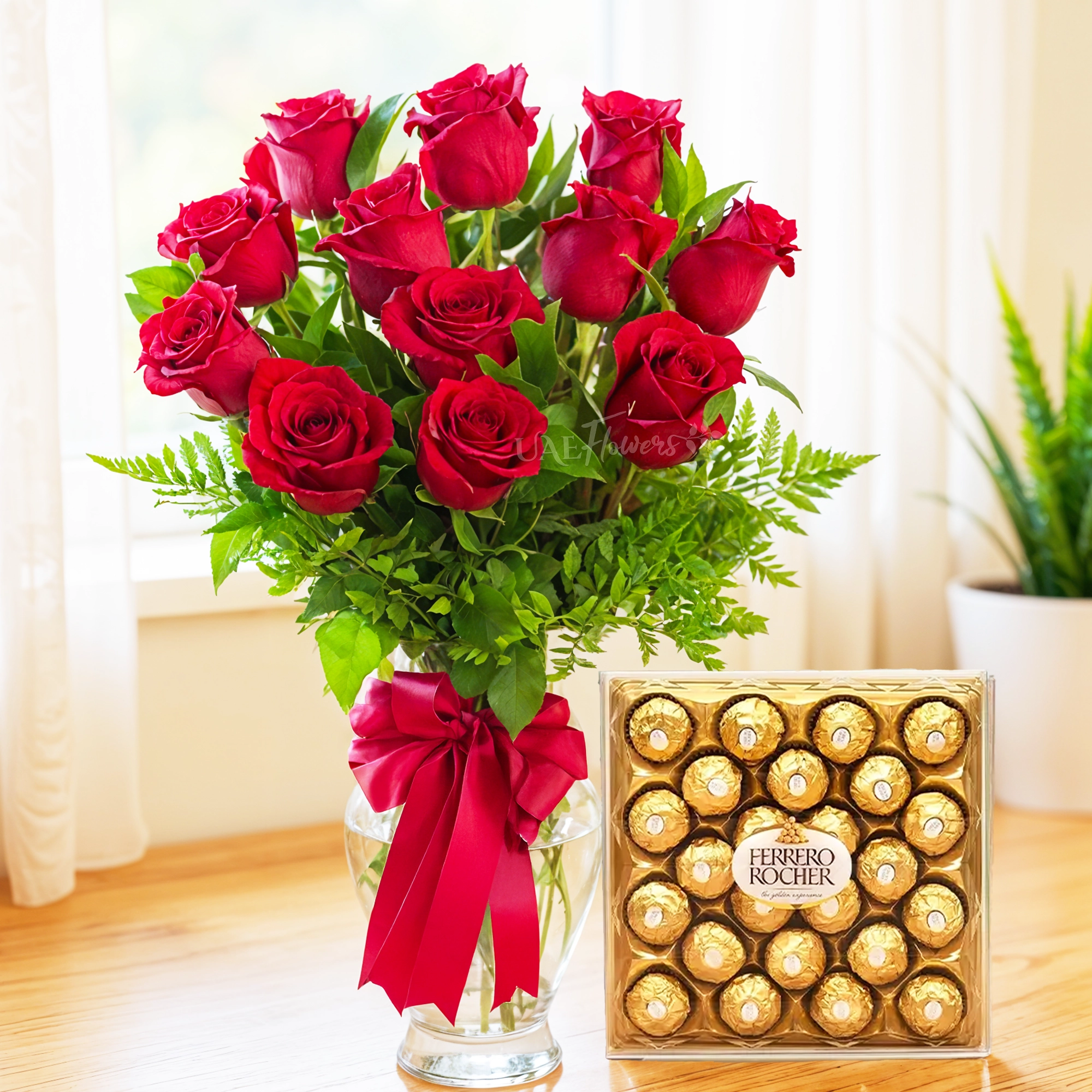 12 red roses in vase with 24 Pcs of Ferrero Rocher Chocolate.