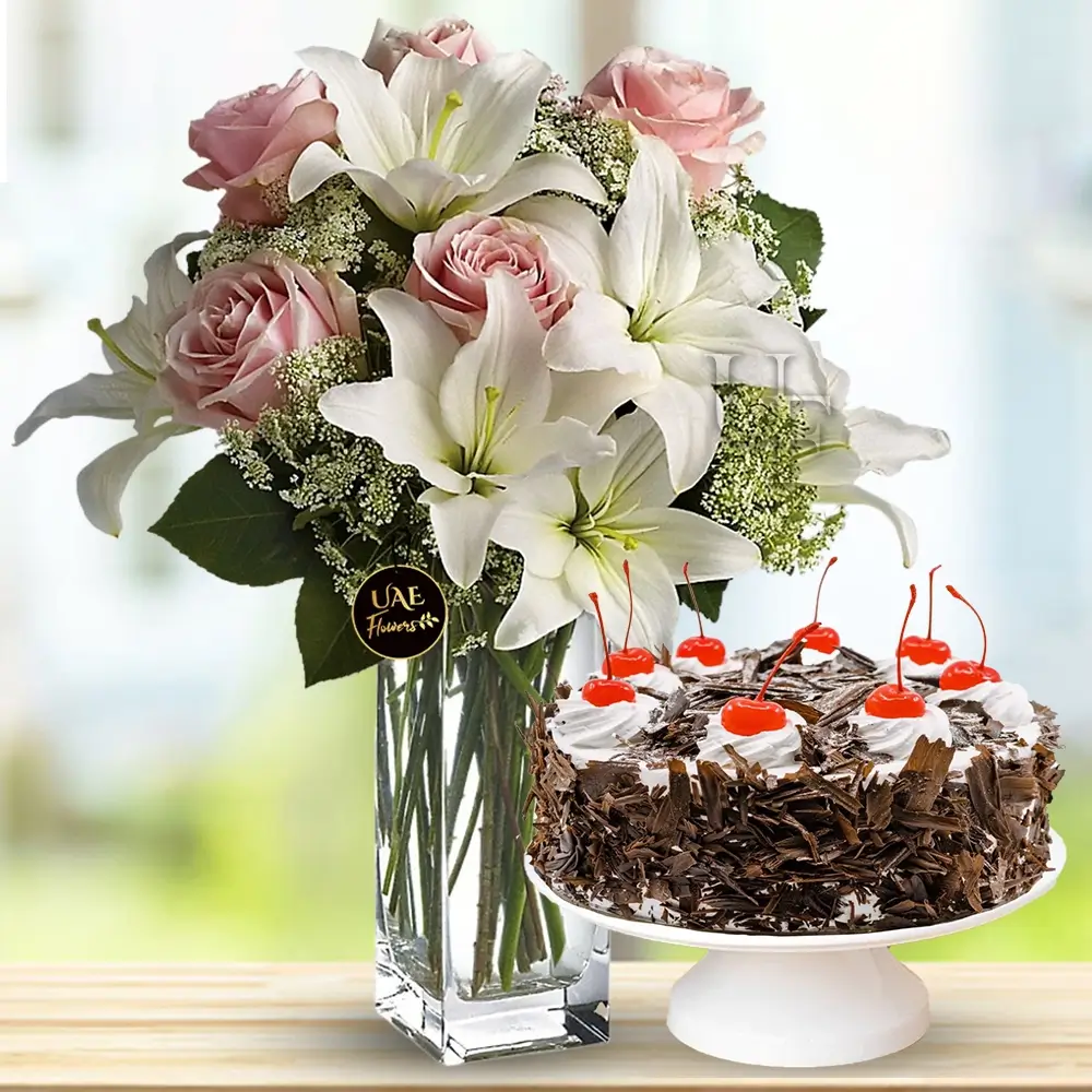 Bouquet of 2 White Lilies and 8 Peach Roses with 1 kg Black Forest Cakes