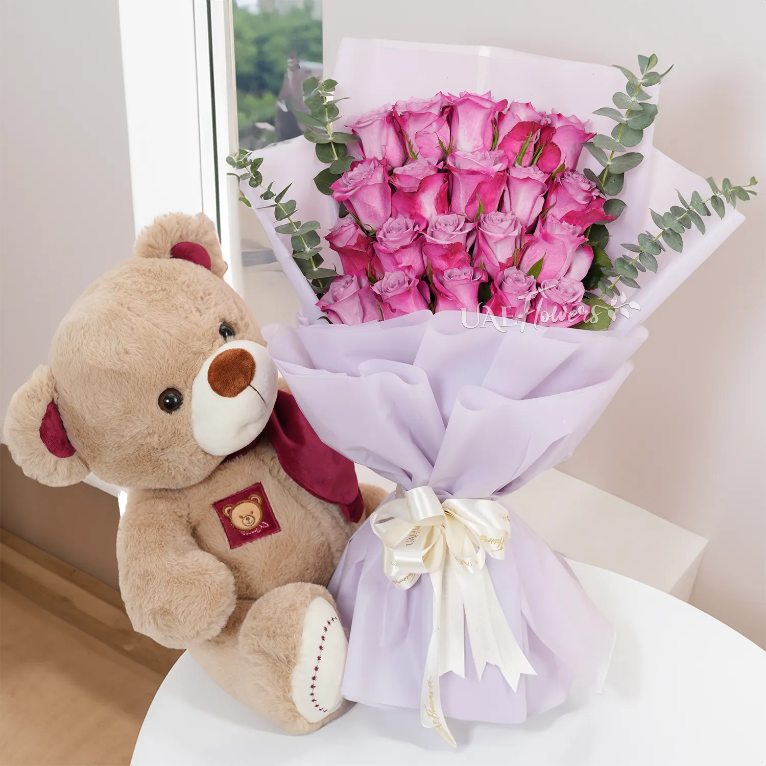 Bouquet of 20 purple roses with small teddy bear