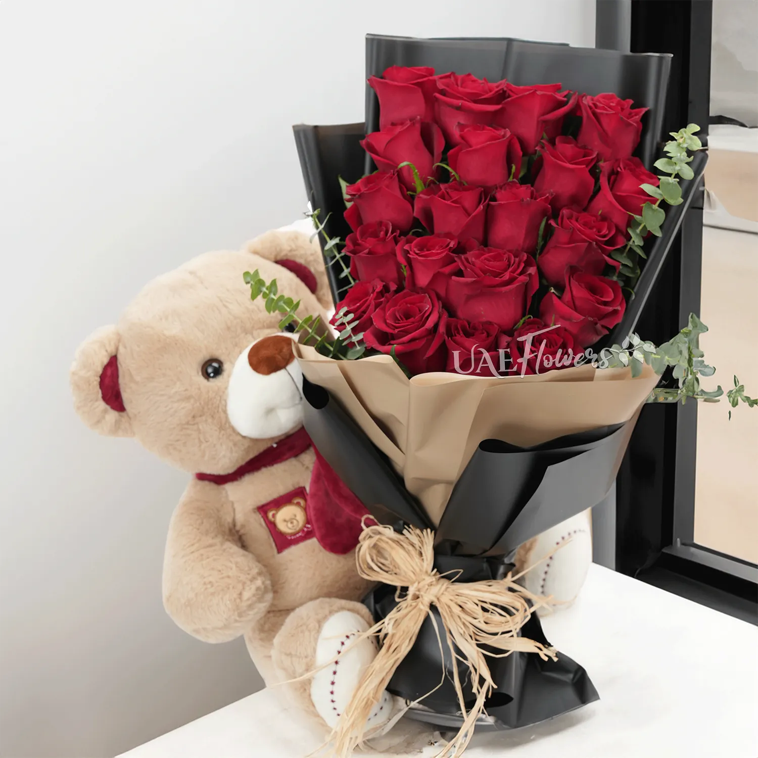 Bouquet of 20 red roses with medium brown teddy bear