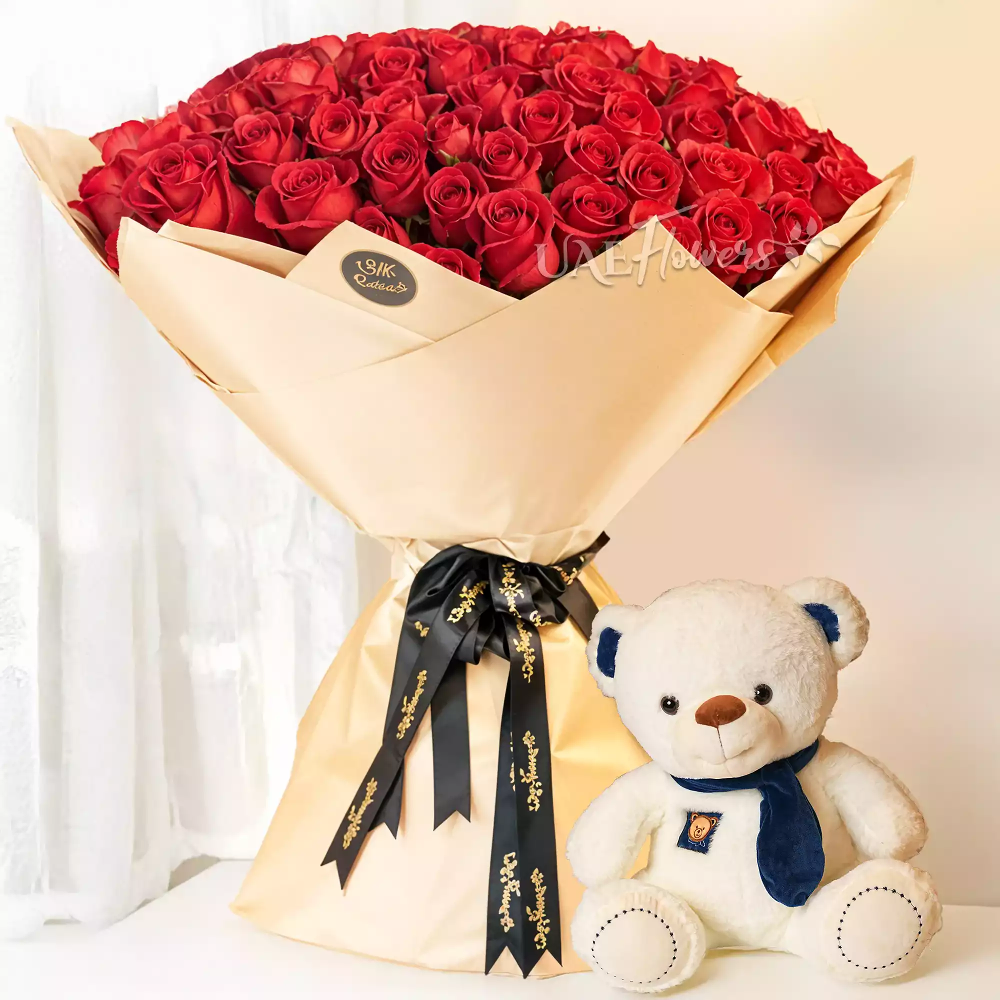 Bouquet of 100 red roses with a Small Size White Teddy Bear