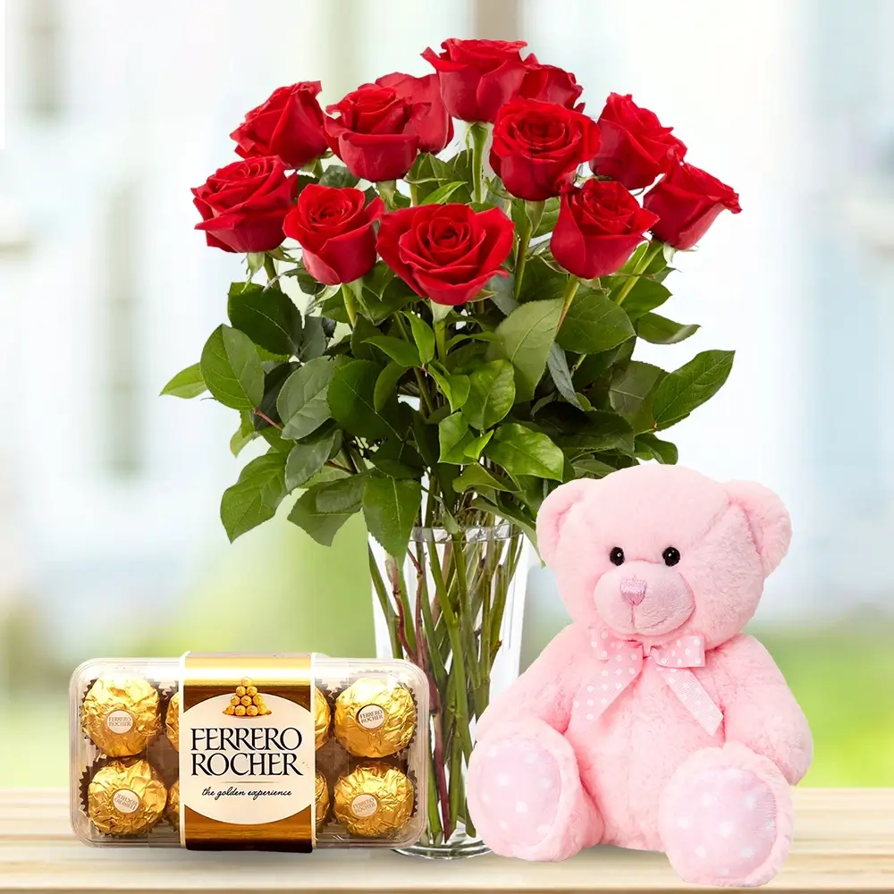 Glass vase of 12 Red Roses with ferrero rocher chocolate with small teddy bear