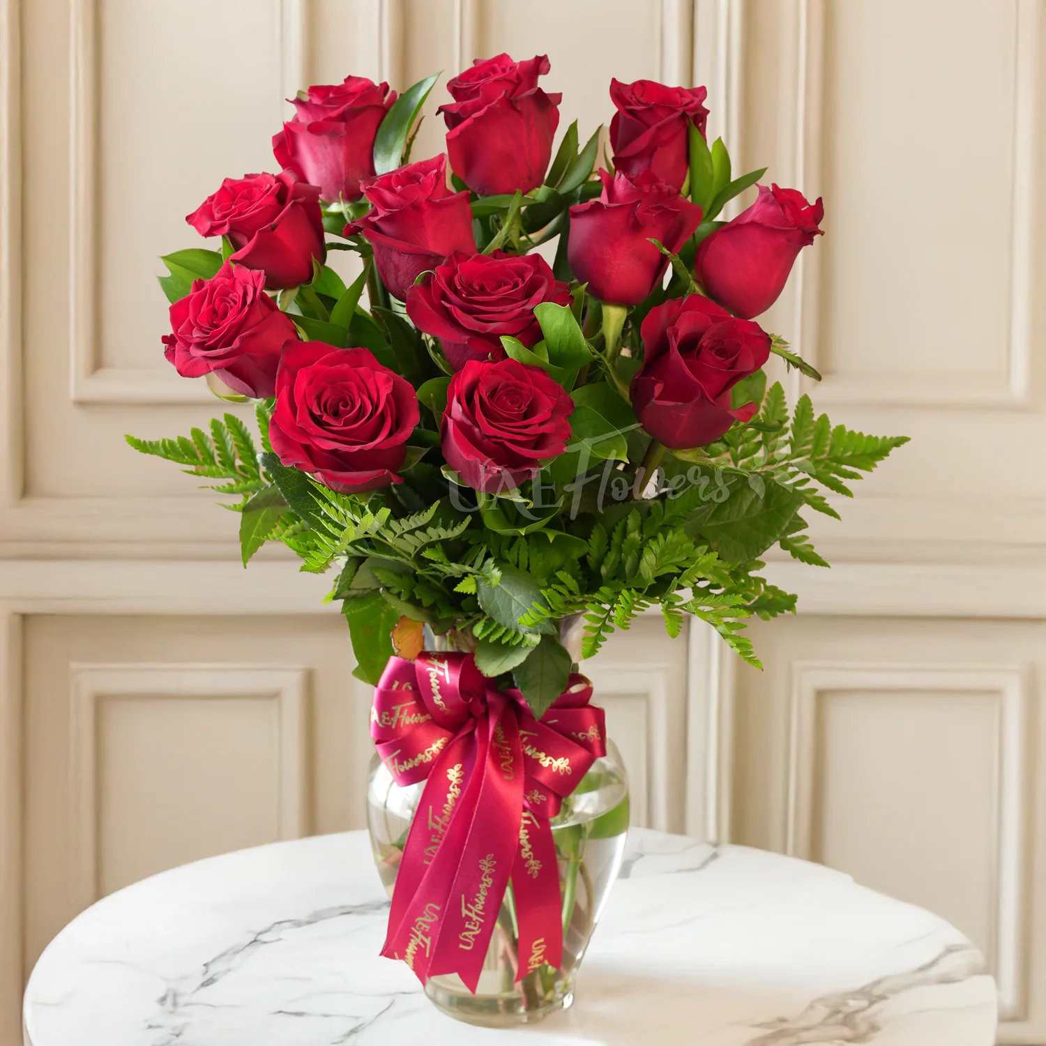 Glass vase of 12 Red Roses with fillers