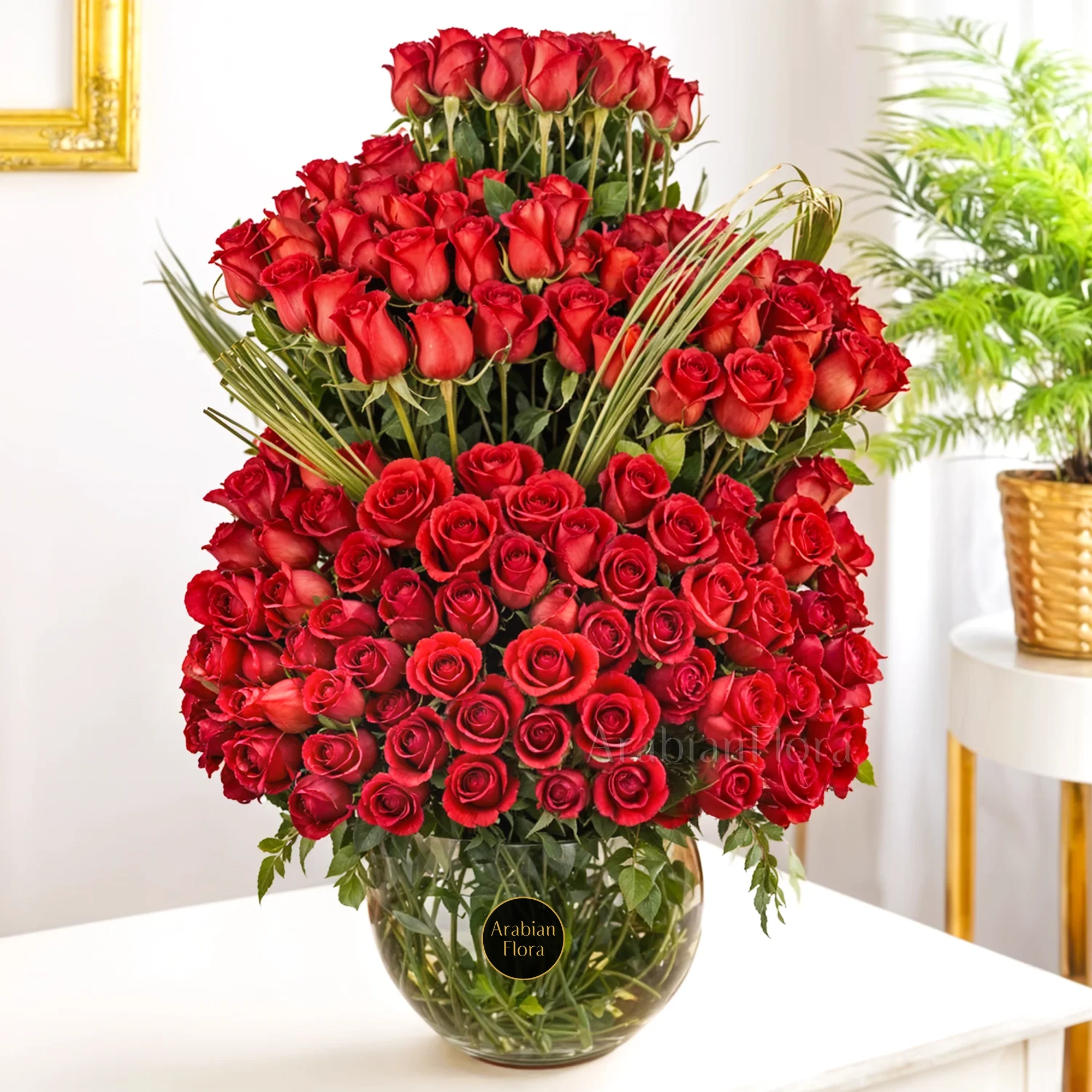 200 red roses with green fillers in a glass vase