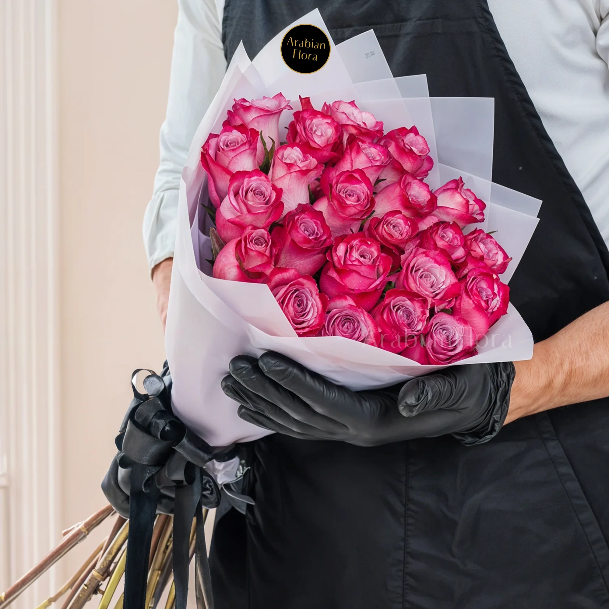 Bouquet of purple roses  with ribbons.