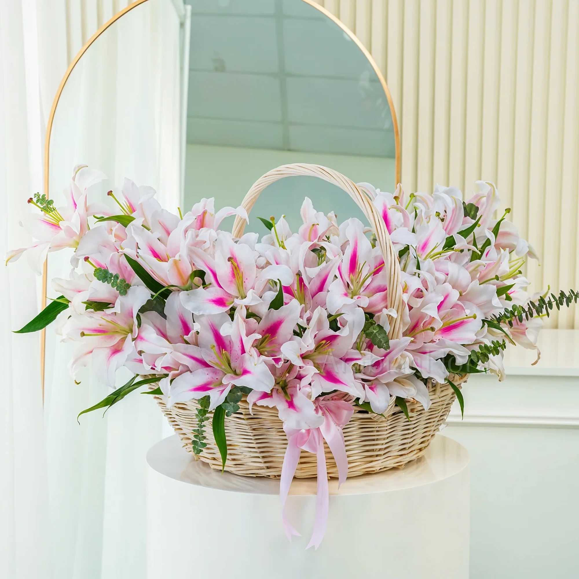 A basket of 30 pink lilies with green fillers.