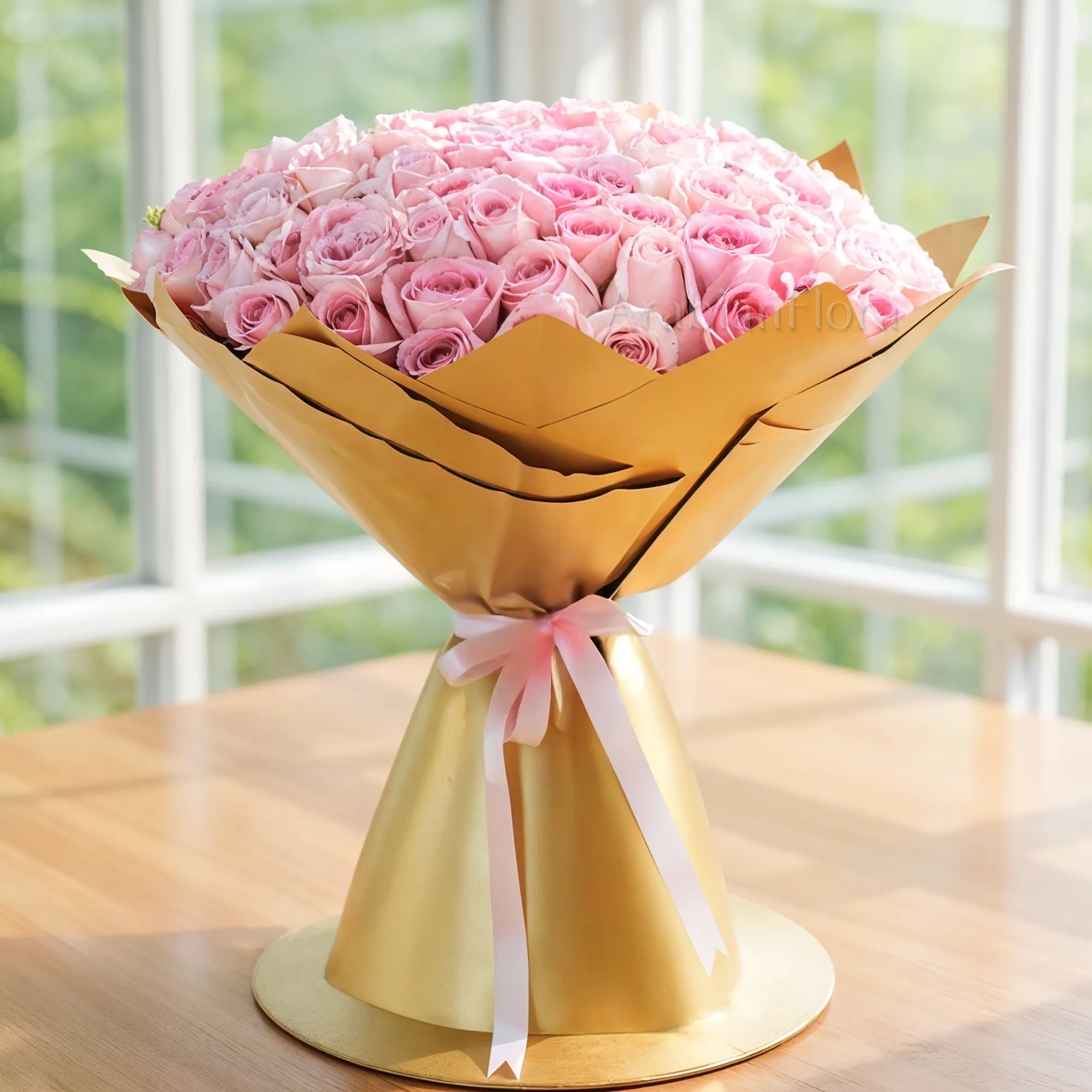 Bouquet of 100 Pink Roses in golden Wrapping Paper with Pink Ribbon.