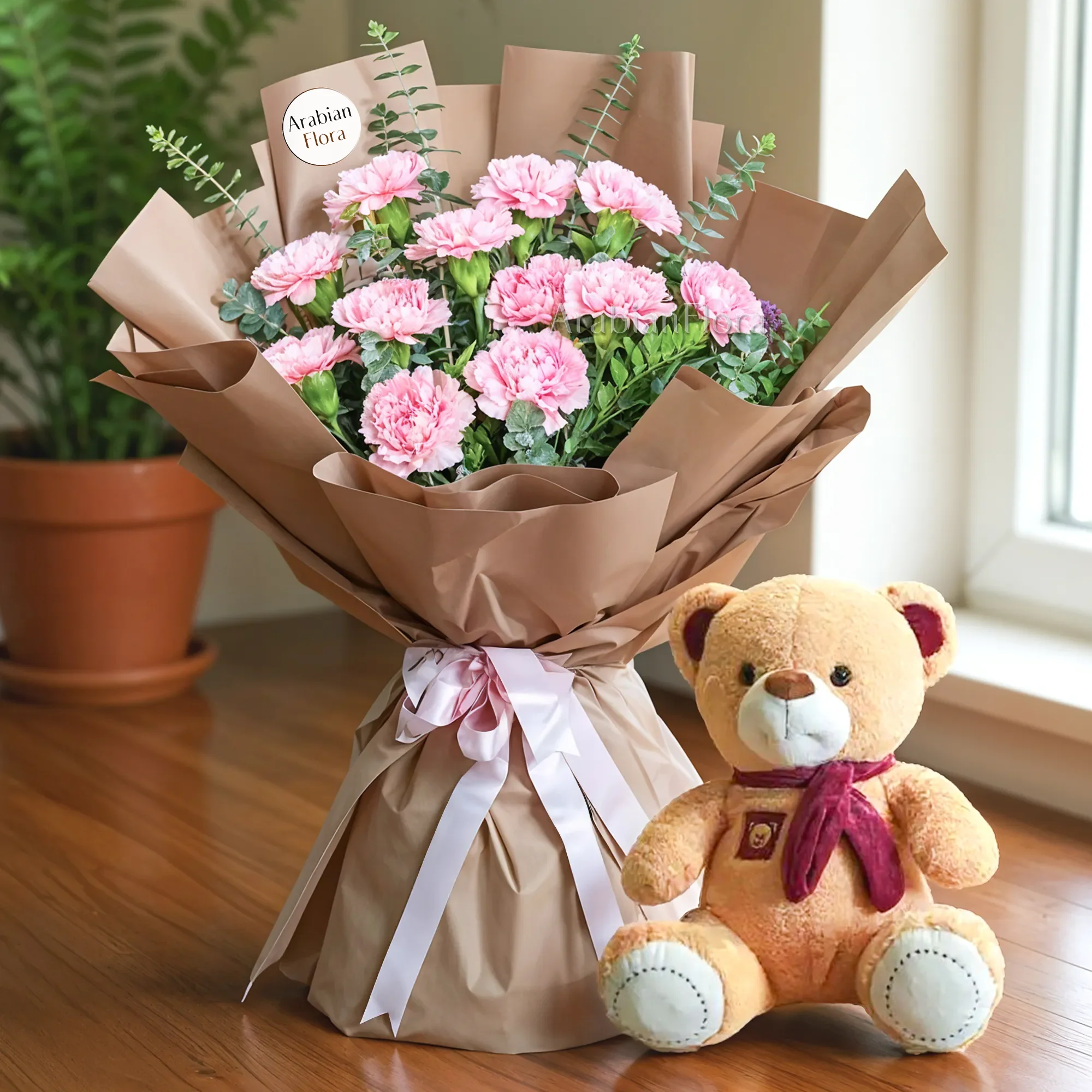 Bouquet of 12 pink carnations with green fillers in nice wrapping and a small teddy bear.