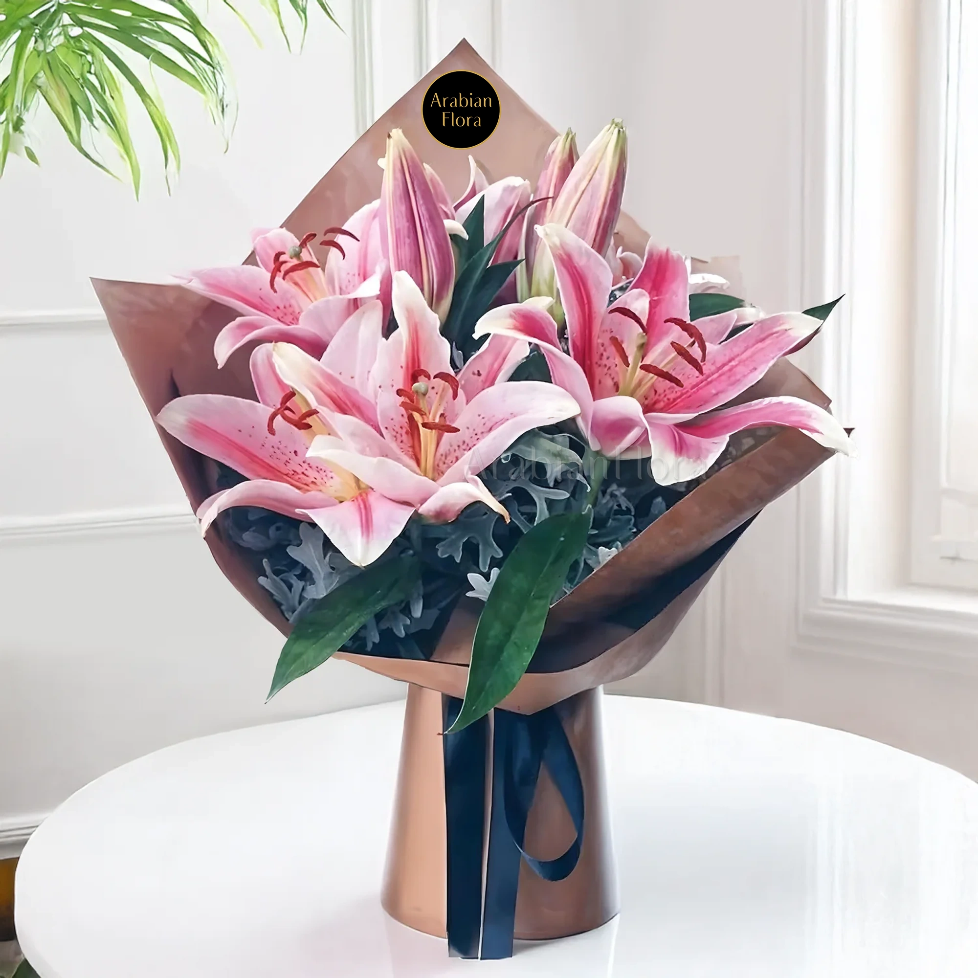 Bouquet of 3 stems of pink lilies and green fillers in a beautiful wrapping.