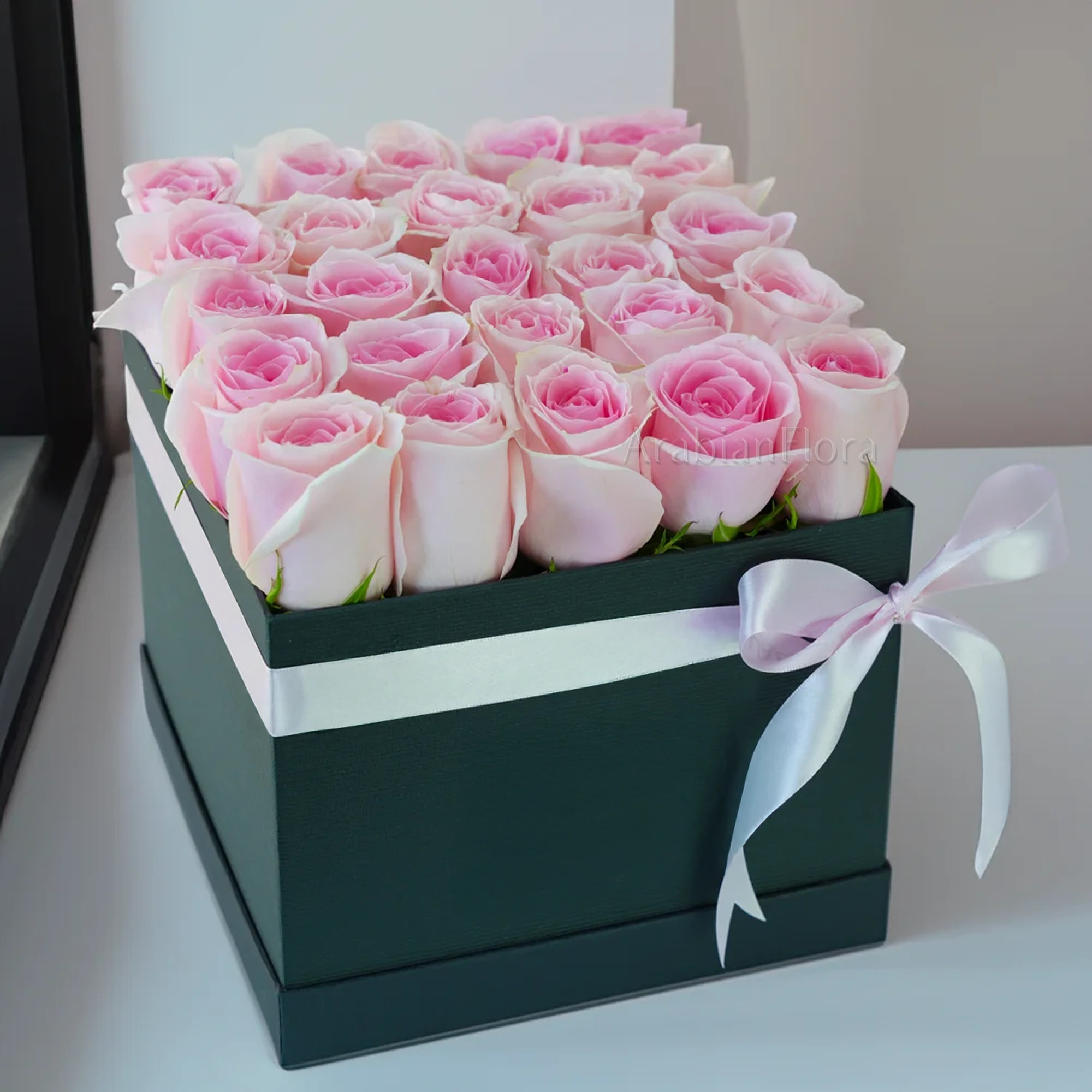 25 pink roses in a square box
