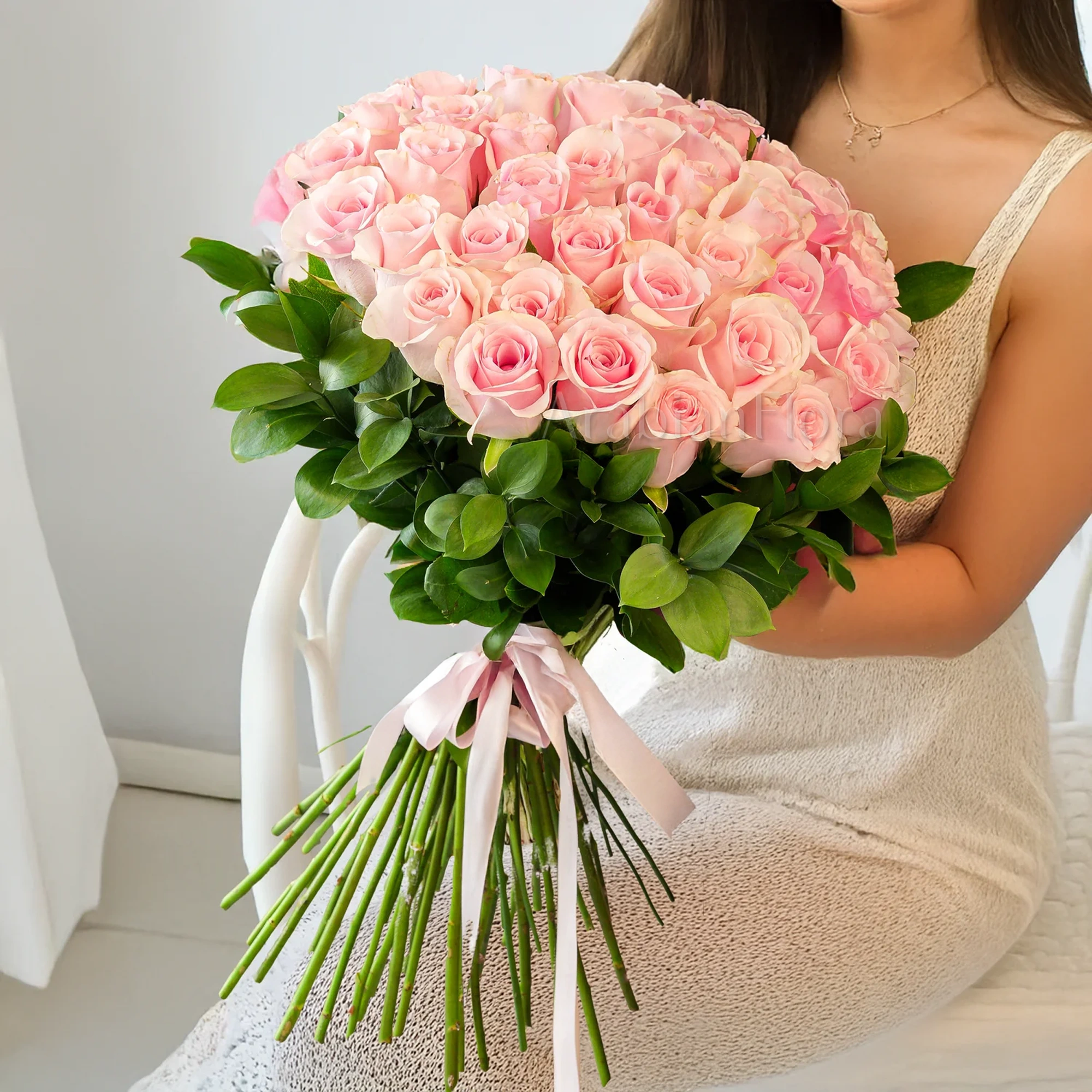 31 pink roses beautifully hand-tied with pink ribbons.