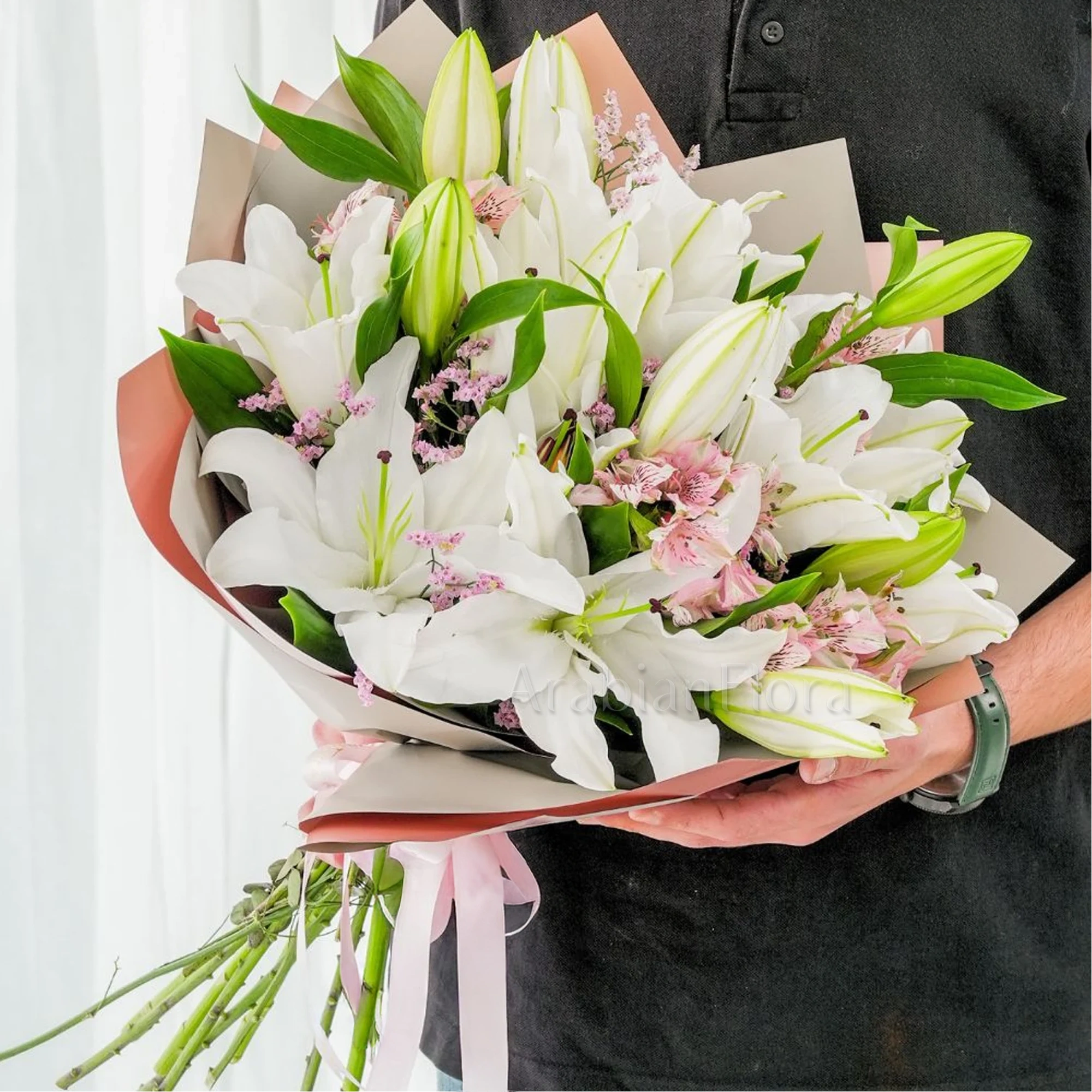 Bouquet of 5 white lilies & alstroemeria with green fillers in nice wrapping.