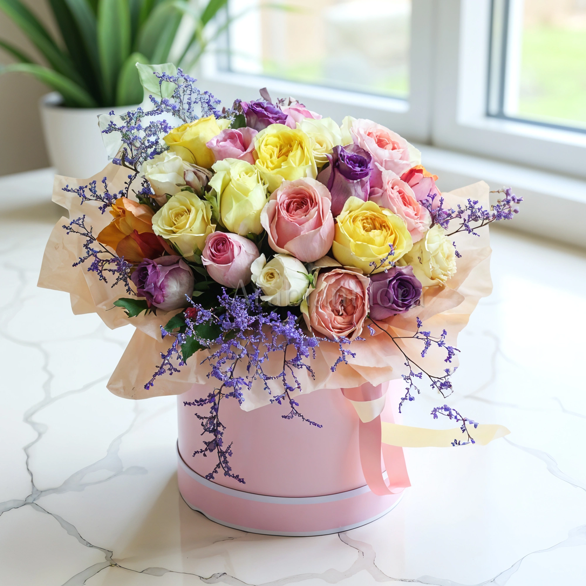 20 stems of mix color roses with fillers in a round box.