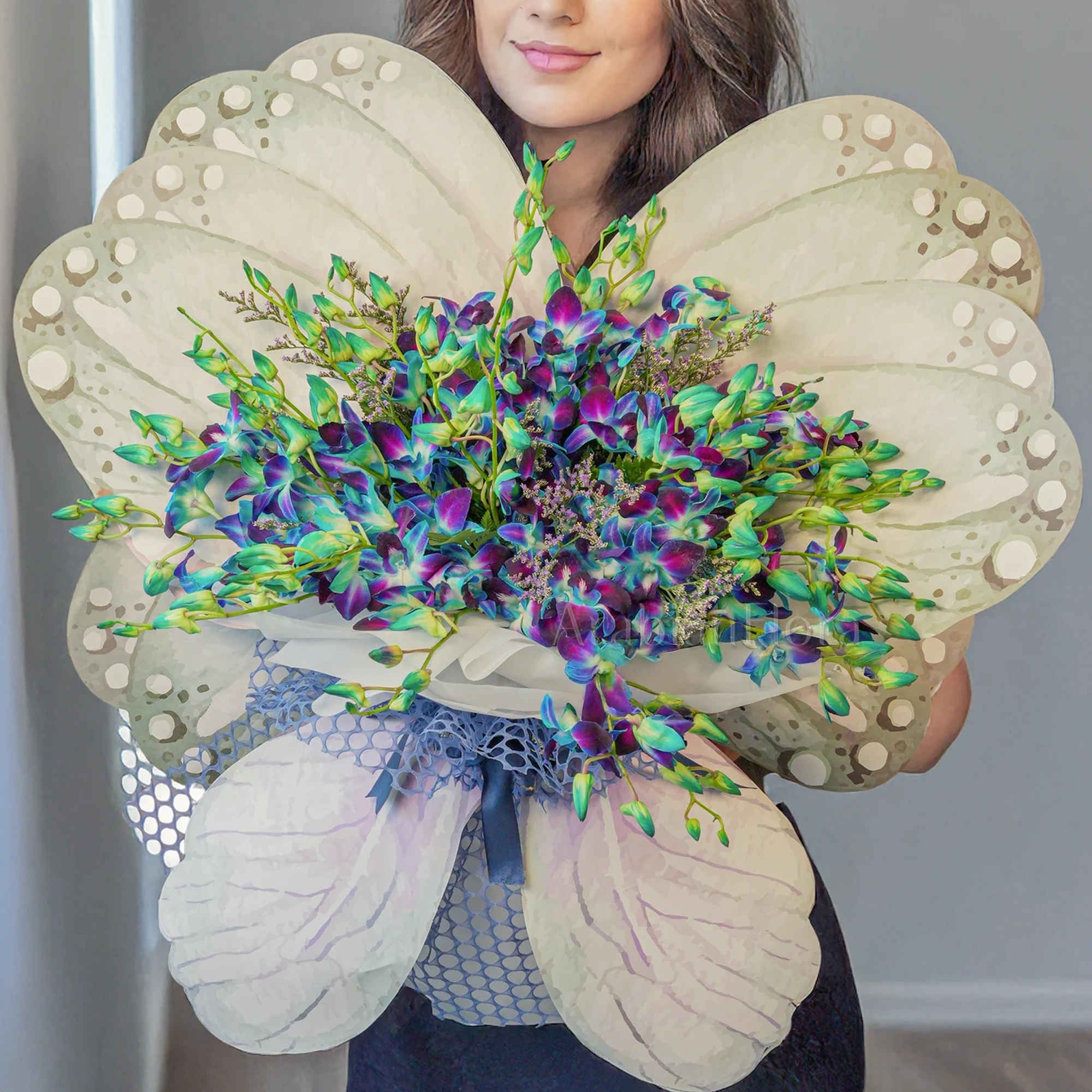 Butterfly bouquet of 20 blue orchids with blue baby's breath fillers tied with ribbons.