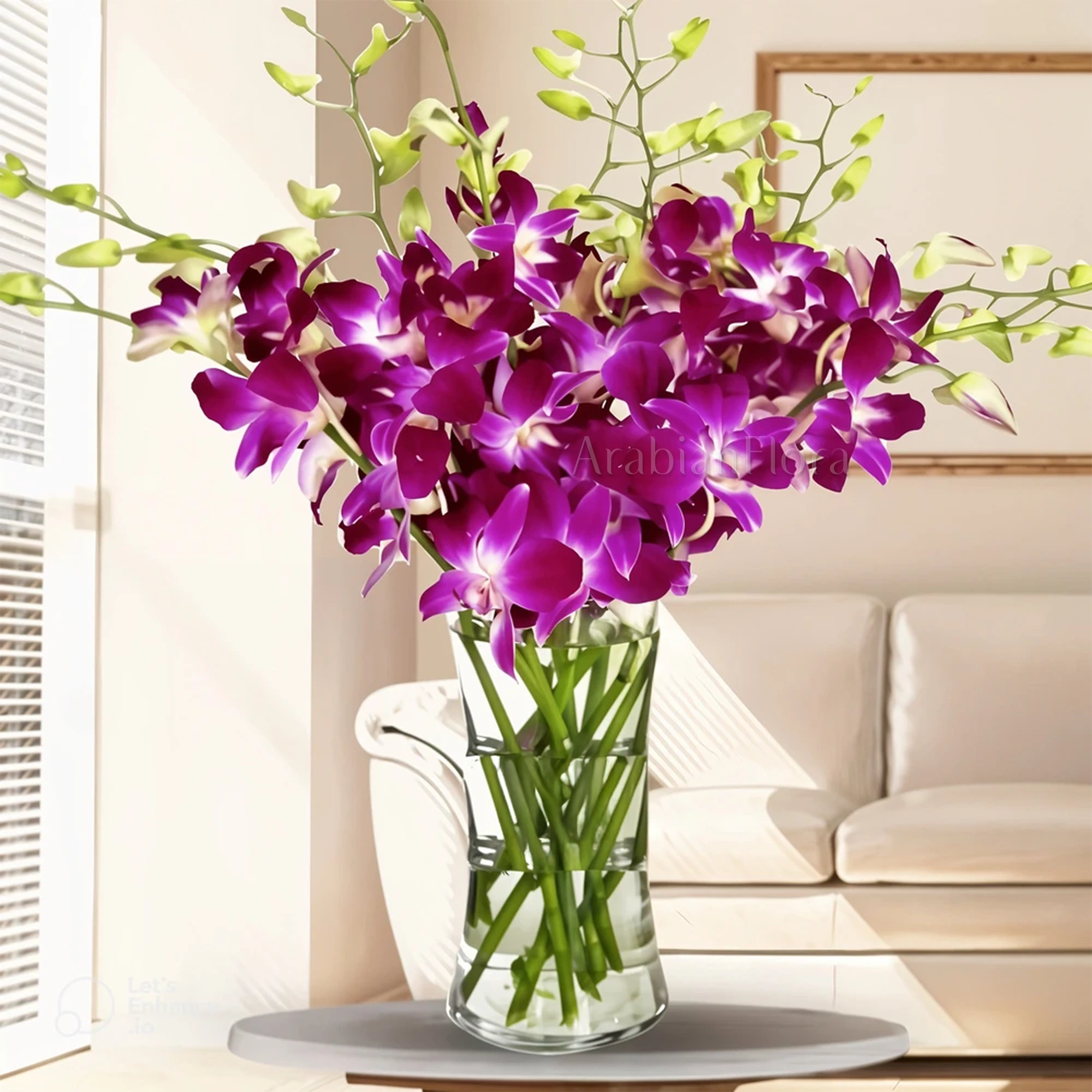 10 deep purple Dendrobium orchids with fillers in glass vase.
