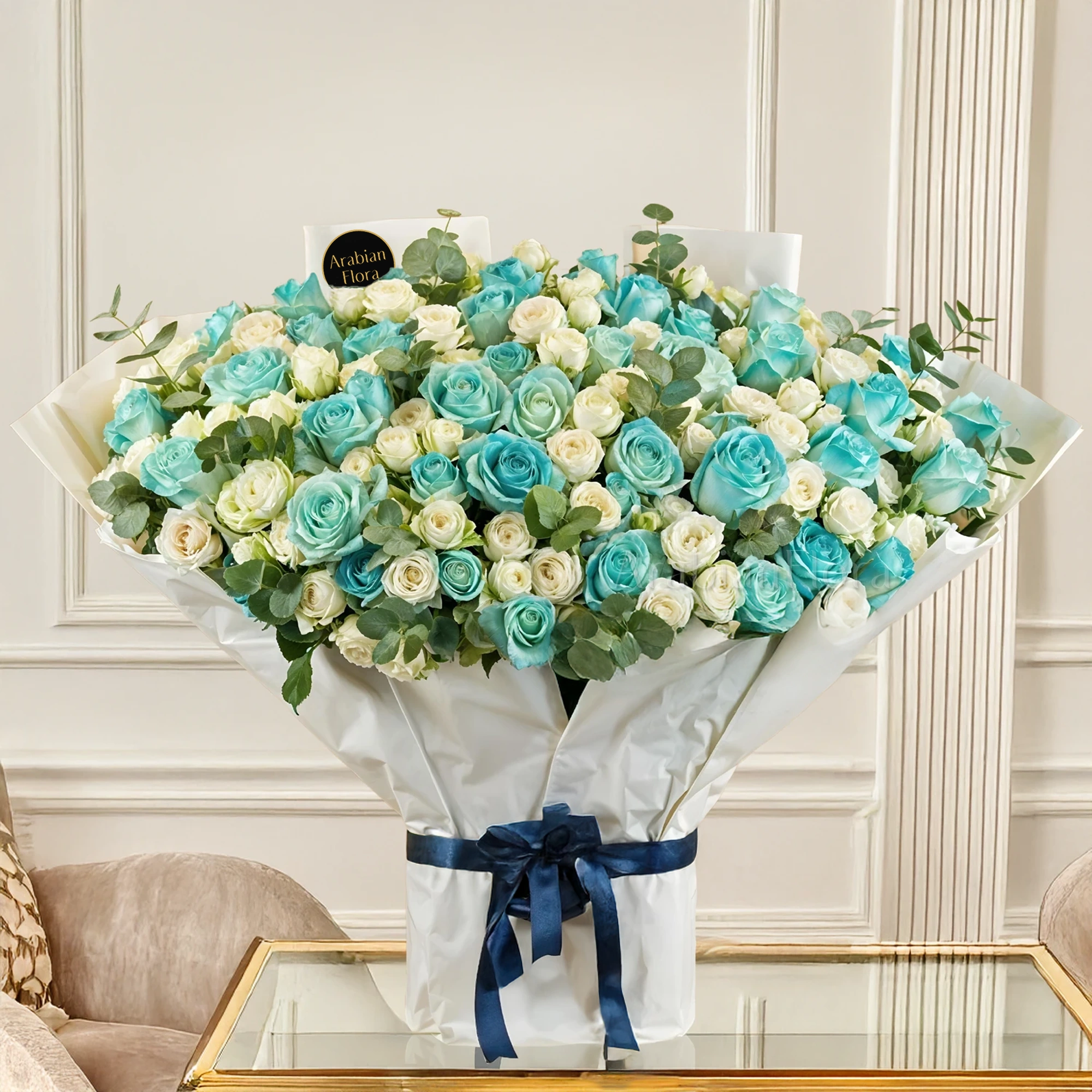 Bouquet of 20 white spray roses and 30 blue sprayed roses with green fillers tied with ribbons.