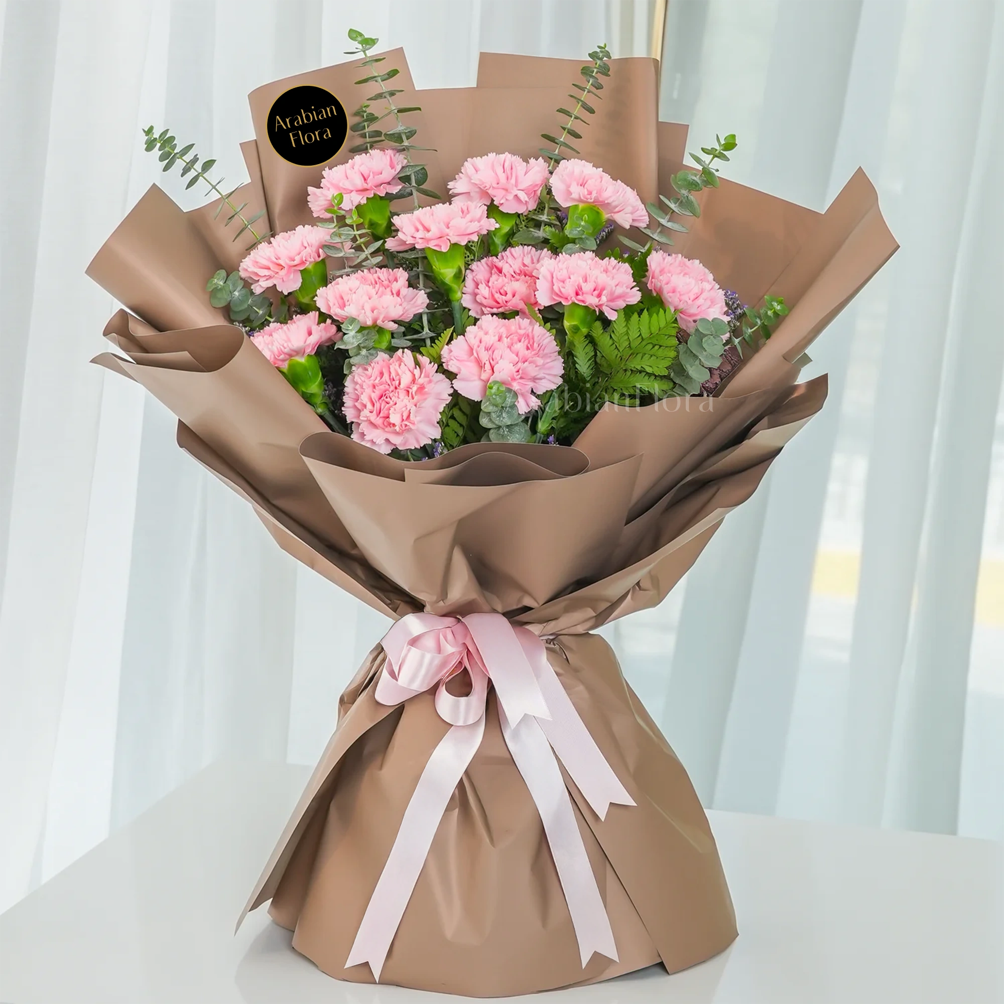 Bouquet of 12 pink carnations.