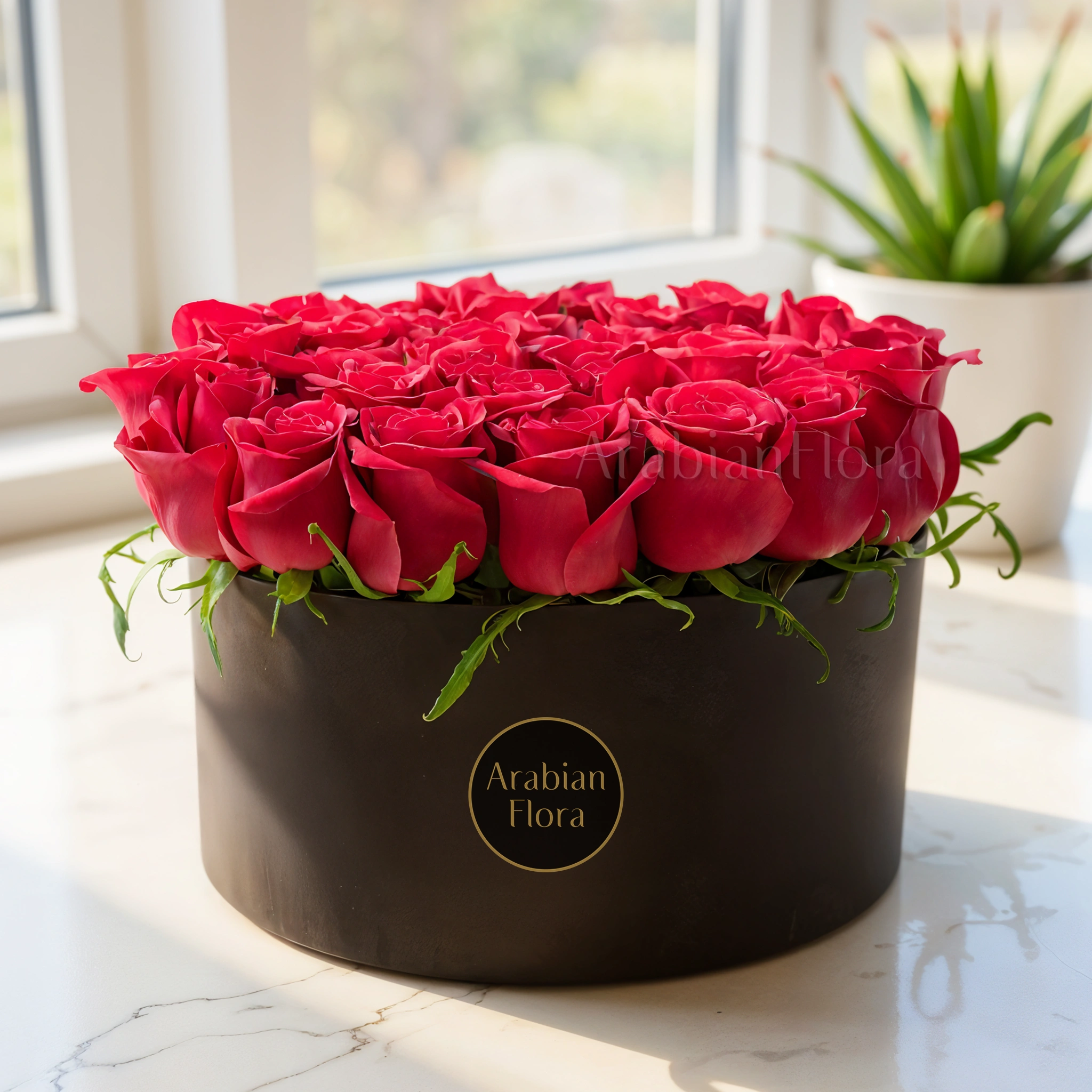 30 red roses with fillers in a round box.