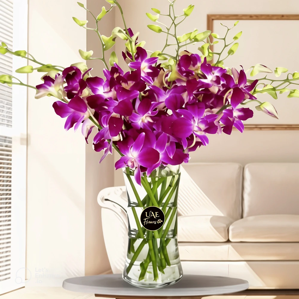 10 deep purple Dendrobium orchids with fillers in glass vase.