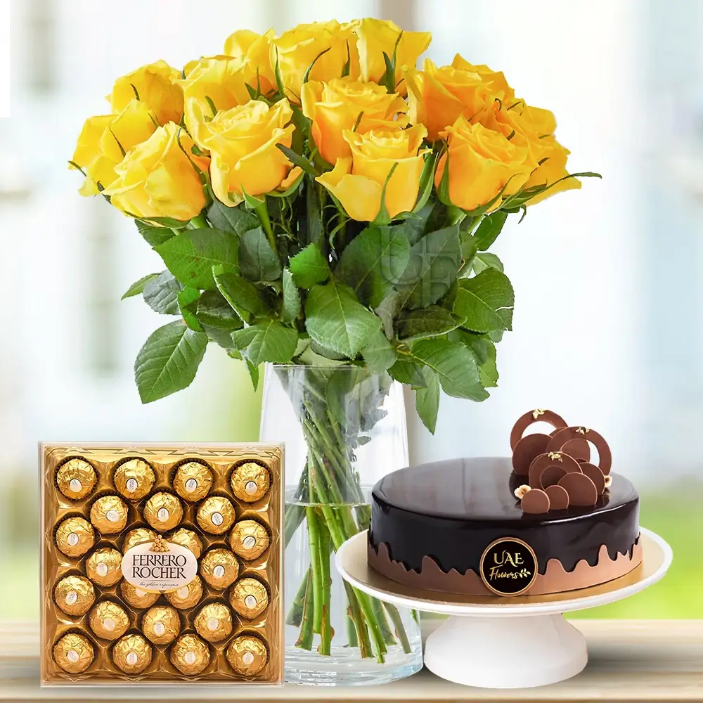 20 yellow roses with fillers in a glass vase with 1 Kg Chocolate Cake and 24 pcs Ferrero Rocher chocolate