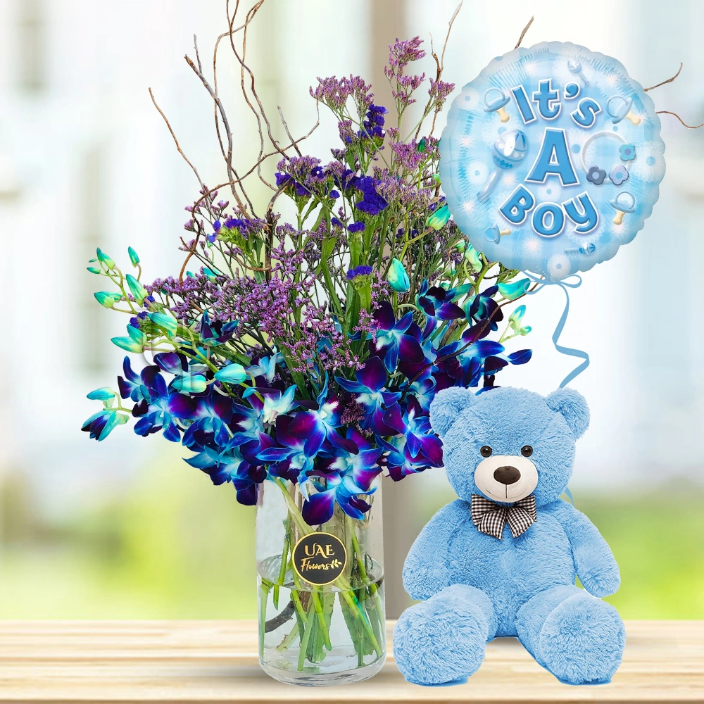 10 Blue Orchids with fillers in a glass vase, Its A Boy Balloon and 12 Inch Blue Teddy Bear