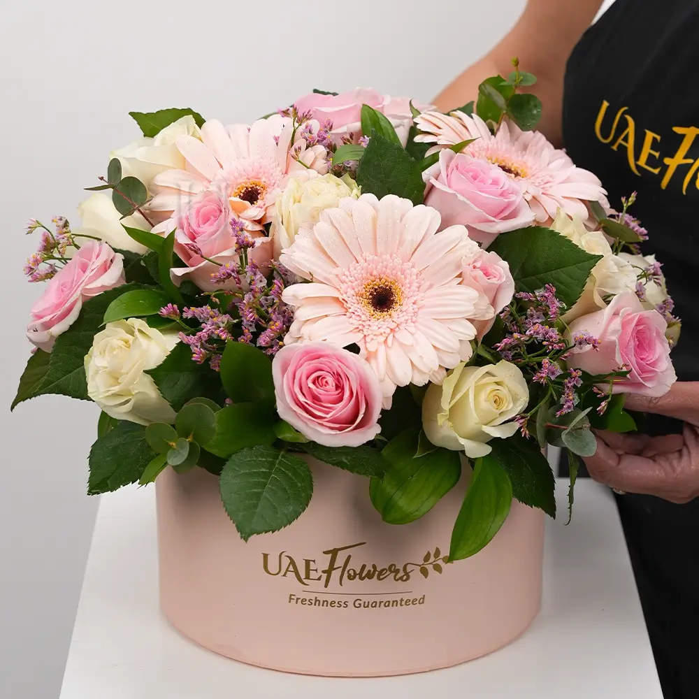 Box arrangement of 3 Pink Gerberas, 10 pink Roses & 10 White Roses with greens and fillers.