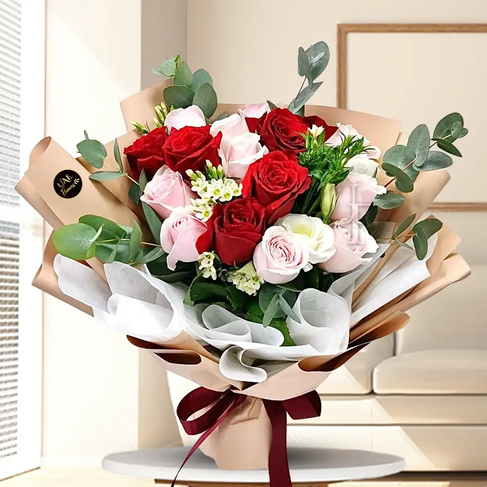 Bouquet of 6 stems of pink roses and 6 stems of red roses with eucalyptus leaf with green fillers in nice wrapping.