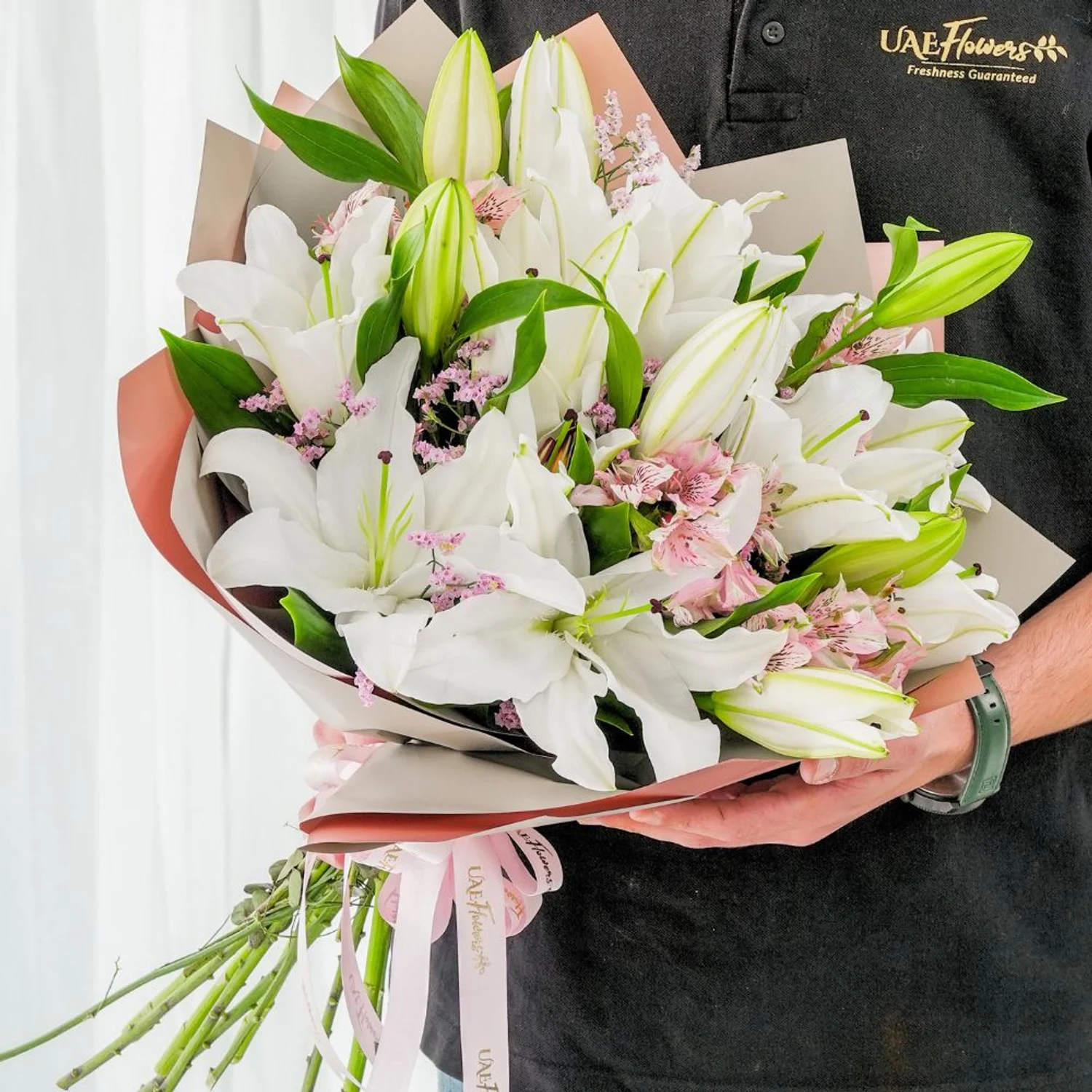 Bouquet of 5 white lilies & alstroemeria with green fillers in nice wrapping.