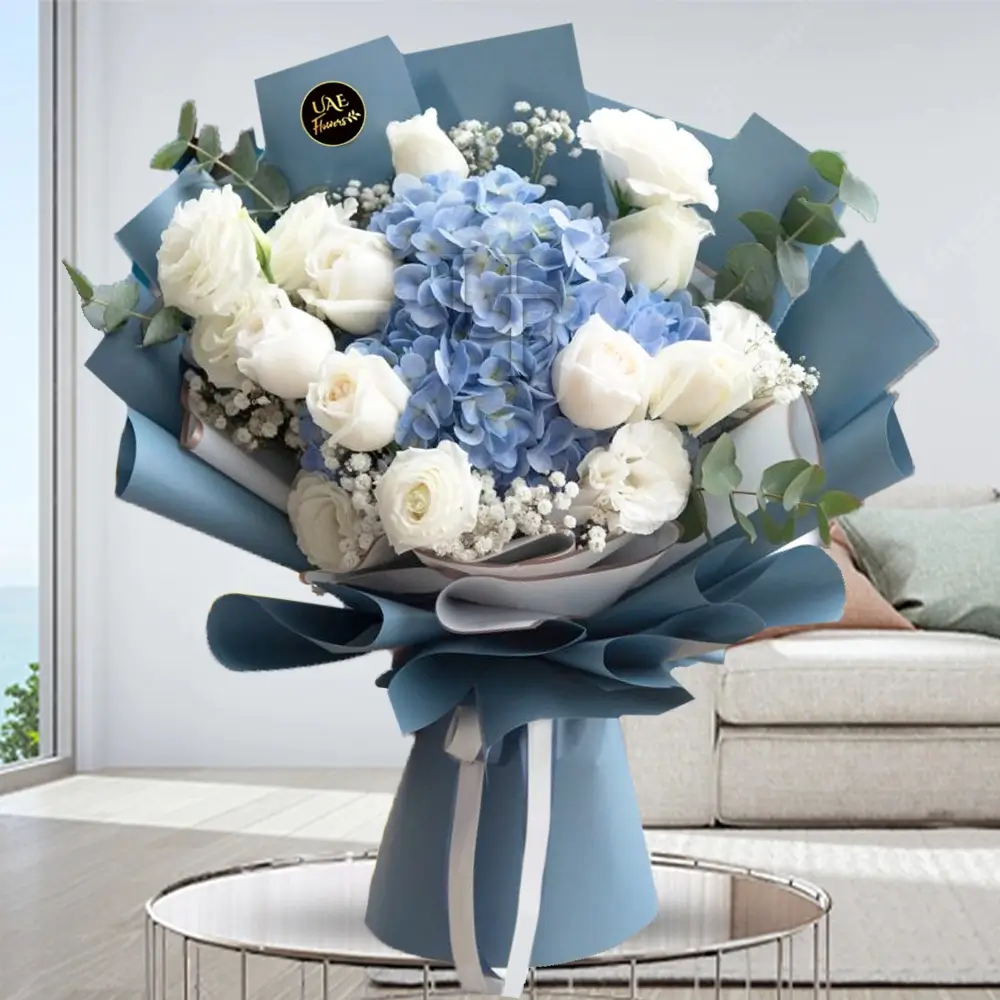Bouquet of 1 Blue Hydrangea and 14 White Roses with baby breath in a nice wrapping.
