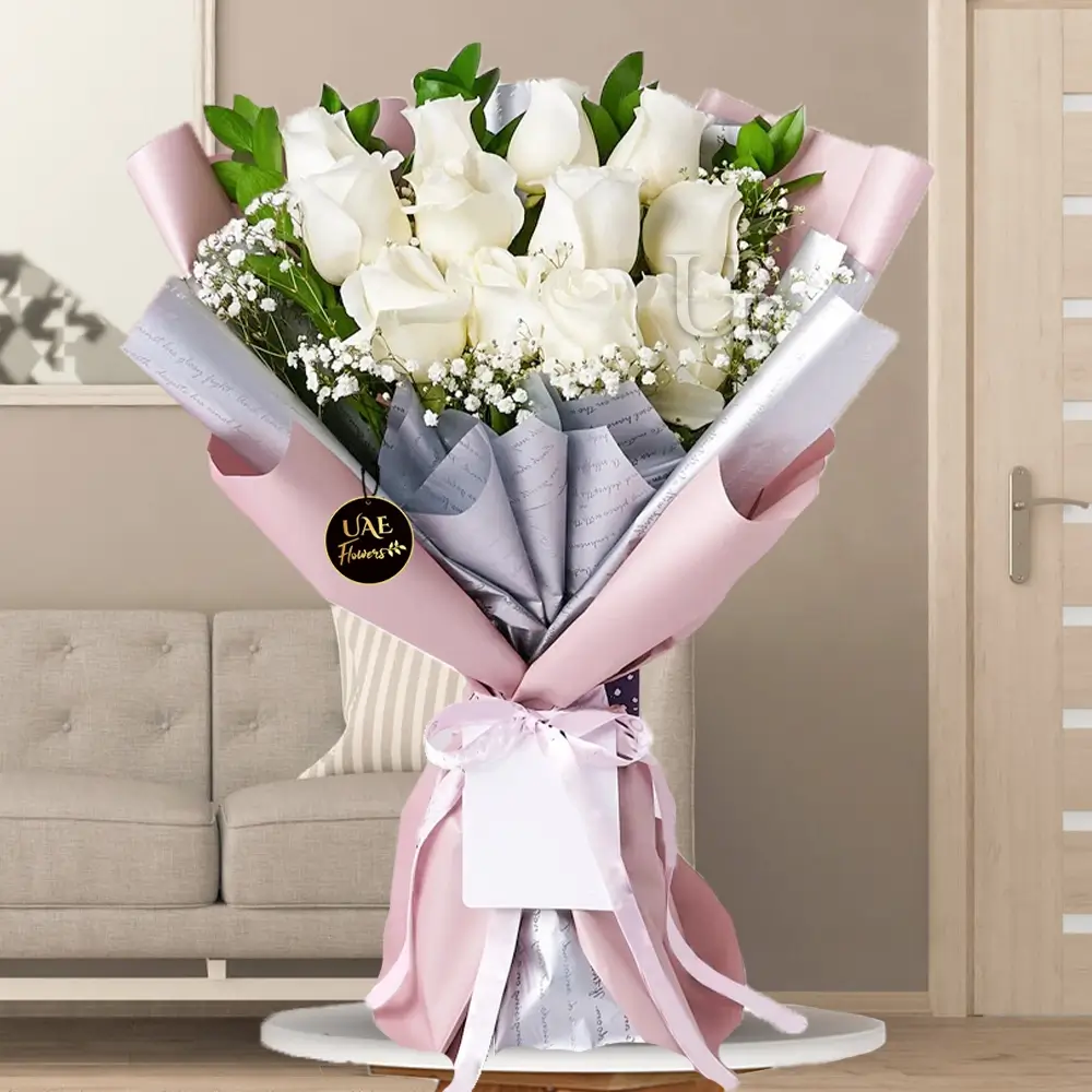 Bouquet of 12 white Roses with fillers in a nice wrapping