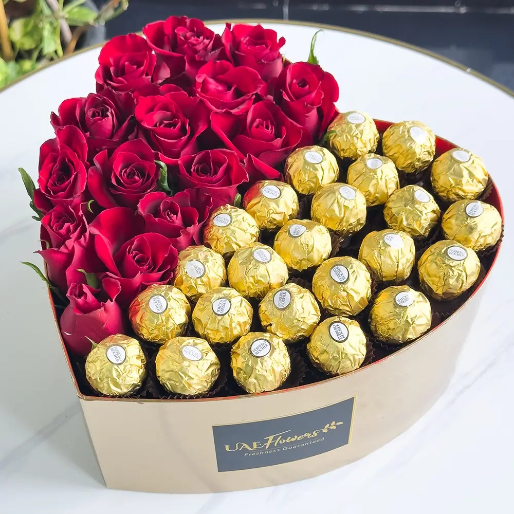 15 stems of red roses and 24 pcs ferrero rocher chocolate in heart shape box.