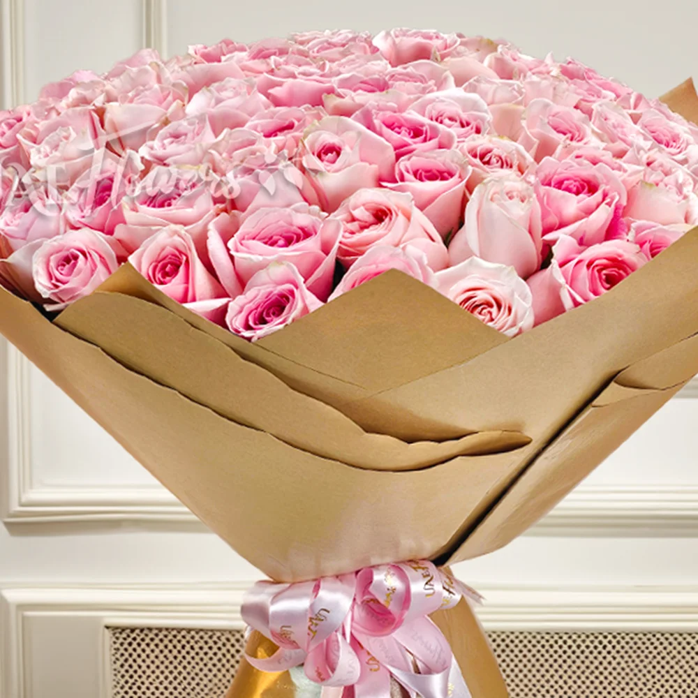 Bouquet of 100 Pink Roses in golden Wrapping Paper with Pink Ribbon.