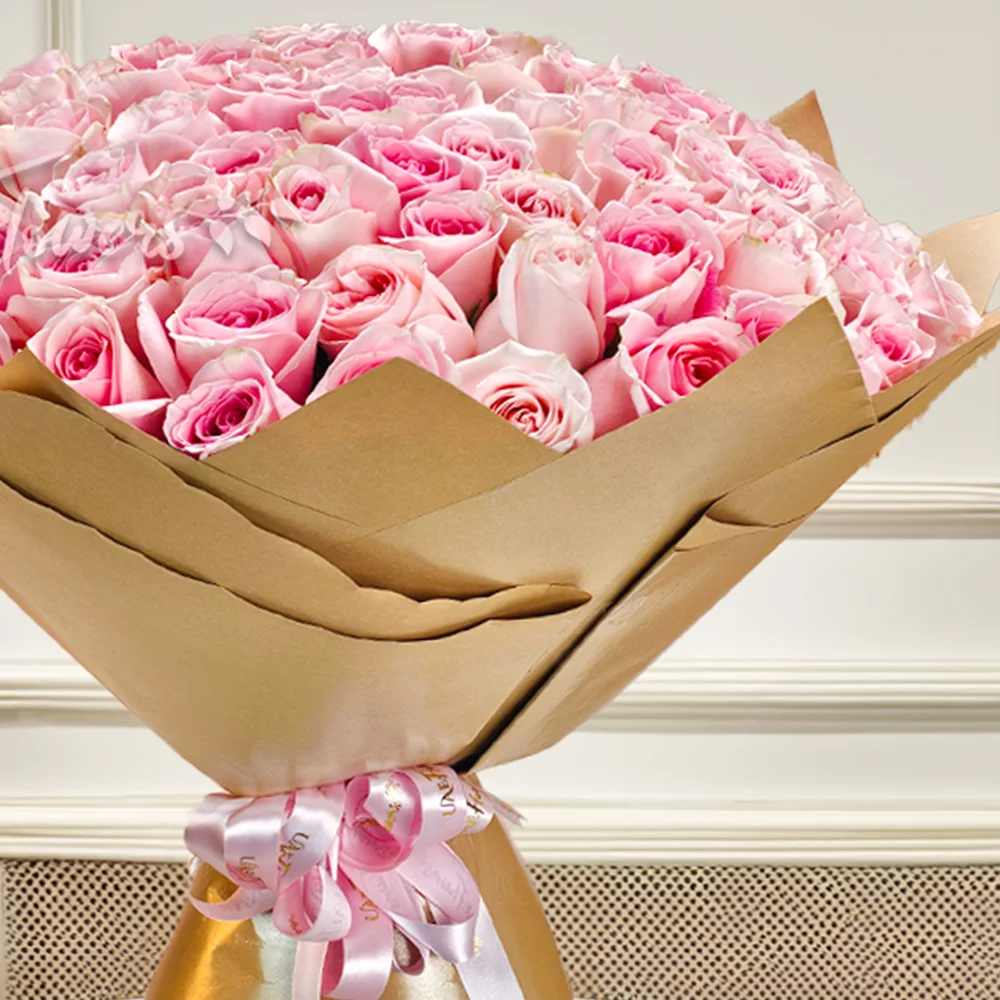 Bouquet of 100 Pink Roses in golden Wrapping Paper with Pink Ribbon.