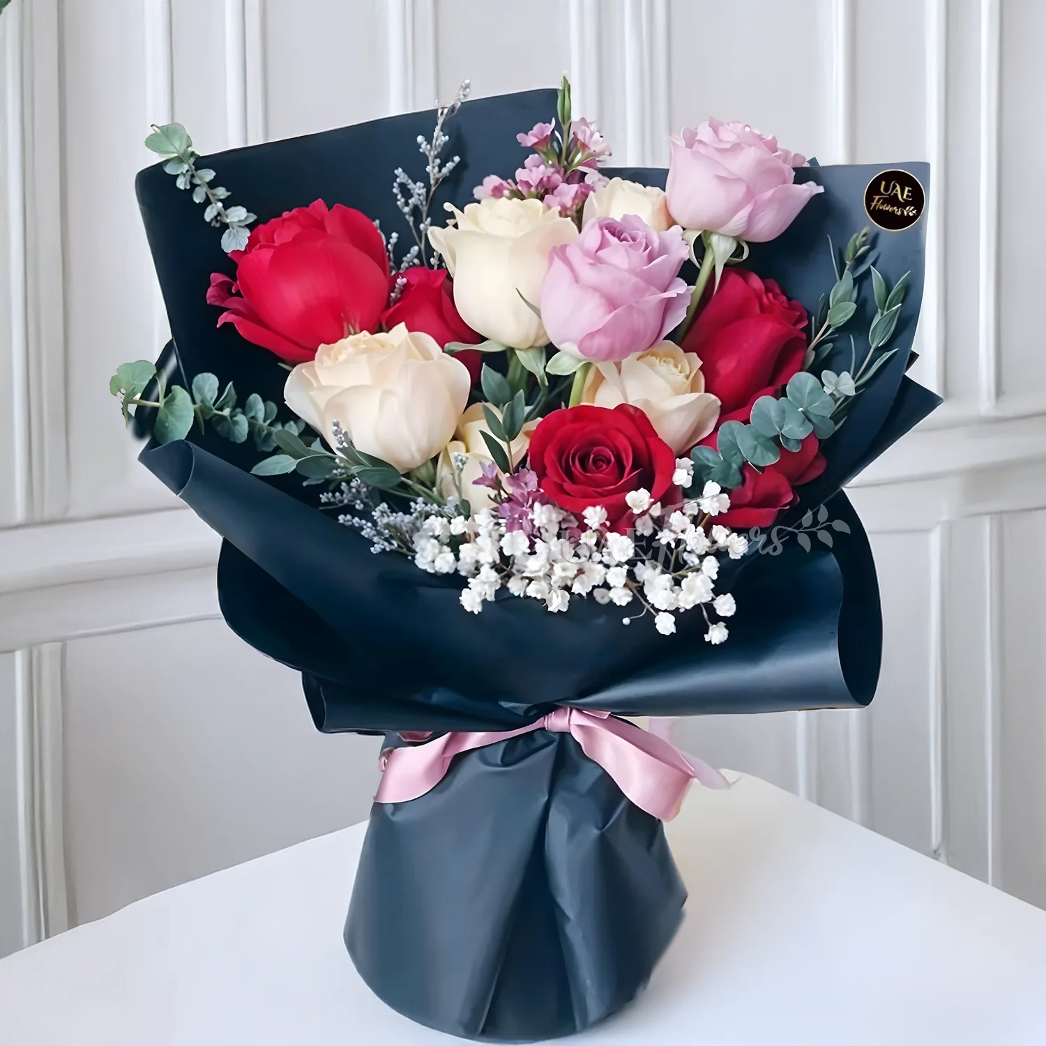 Bouquet of 5 red roses, 5 peach roses, 2 purple roses & white baby breath in nice wrapping