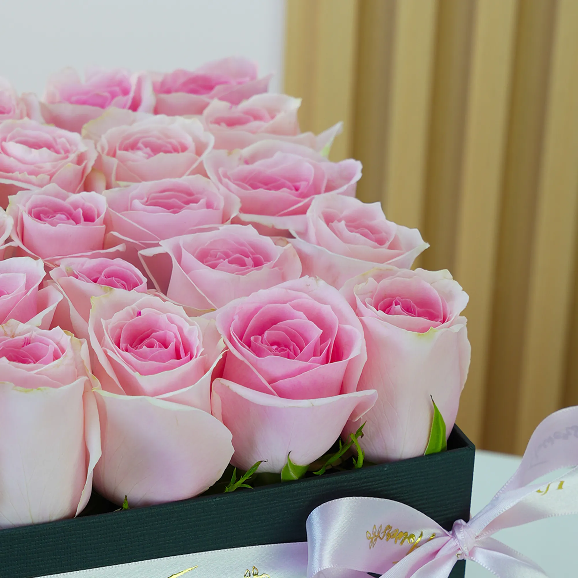 25 pink roses in a square box