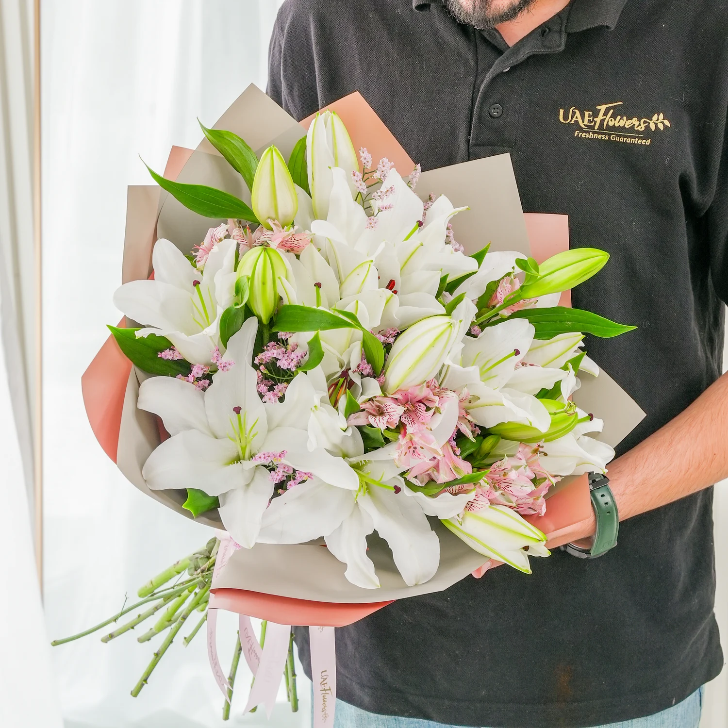 Bouquet of 5 white lilies & alstroemeria with green fillers in nice wrapping.