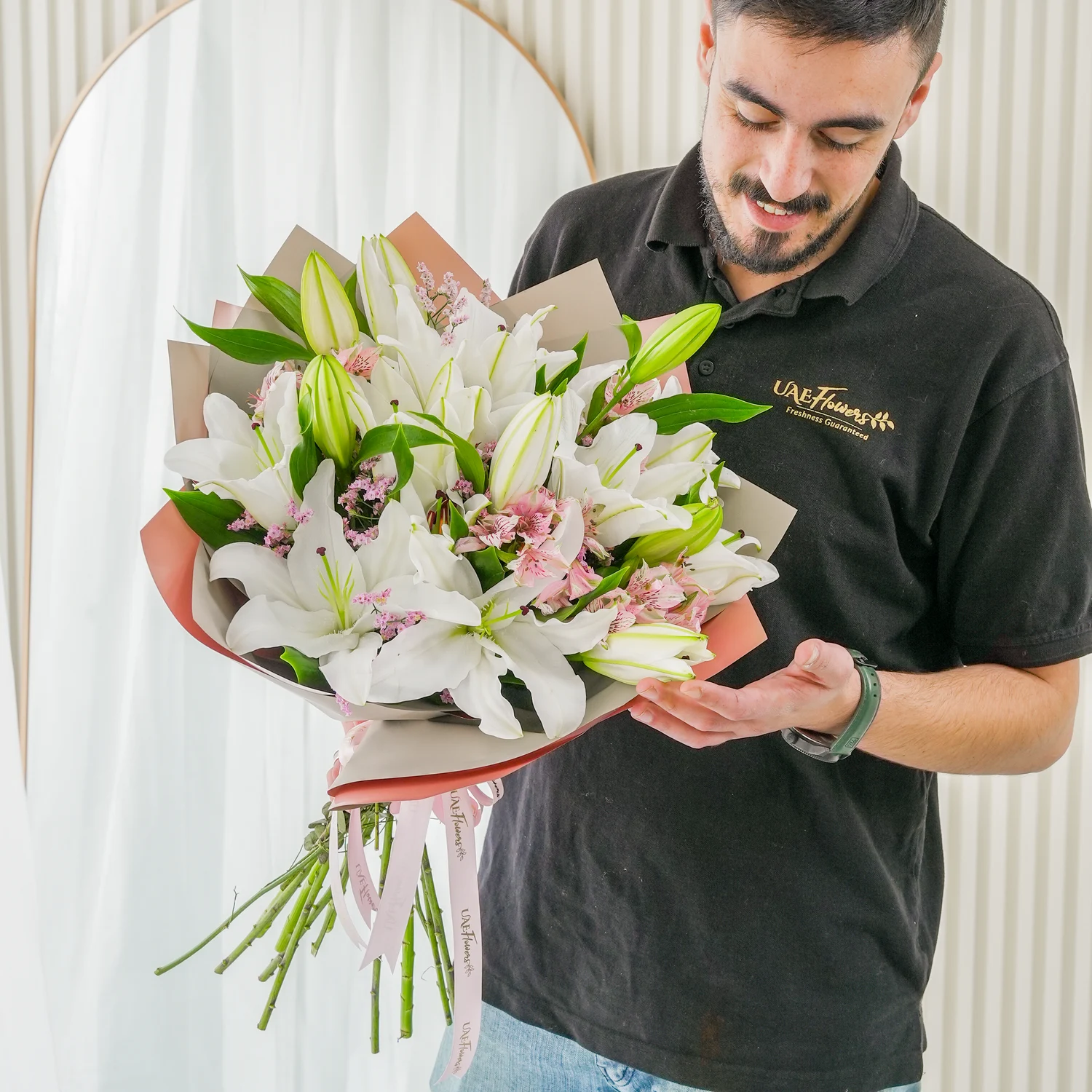 Bouquet of 5 white lilies & alstroemeria with green fillers in nice wrapping.