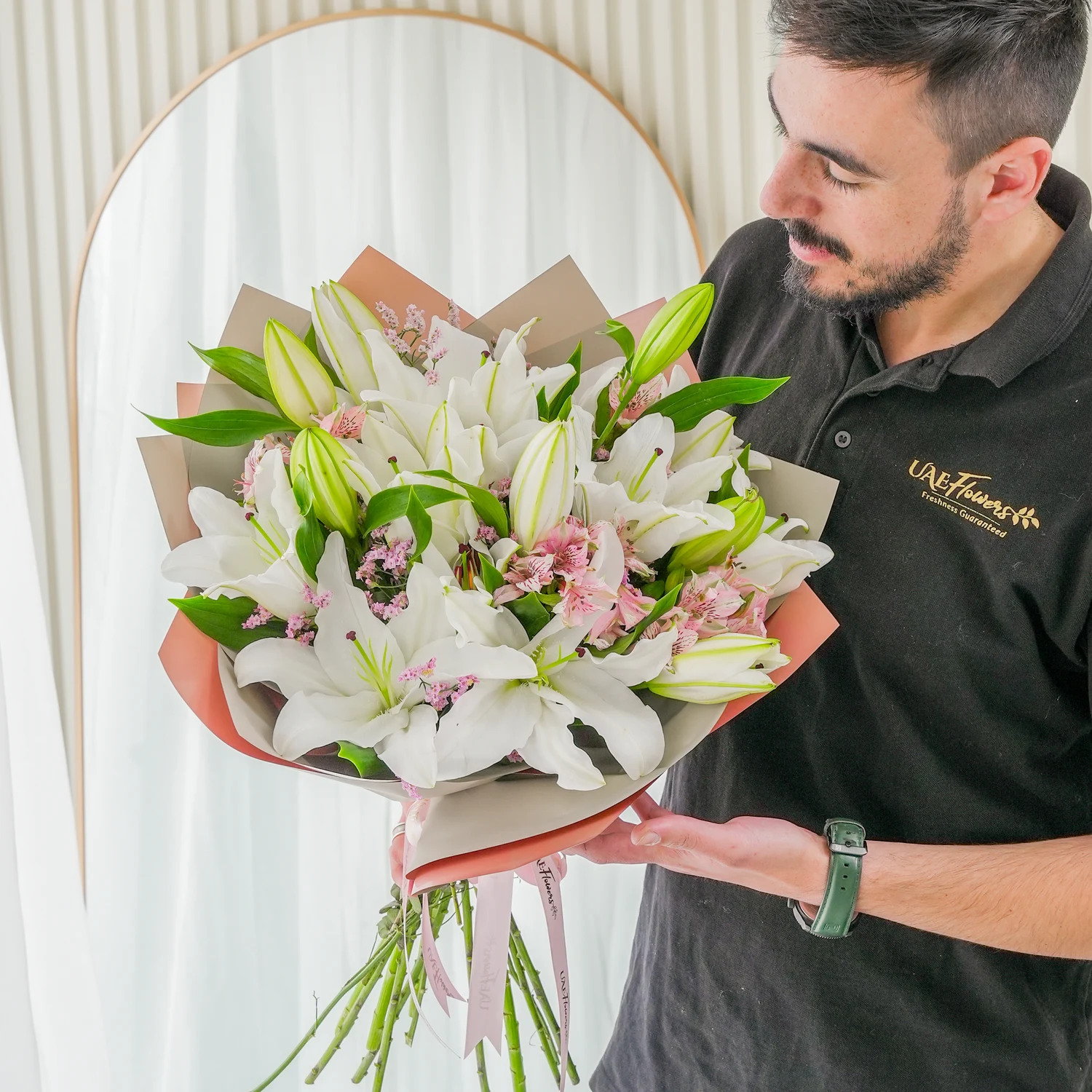 Bouquet of 5 white lilies & alstroemeria with green fillers in nice wrapping.