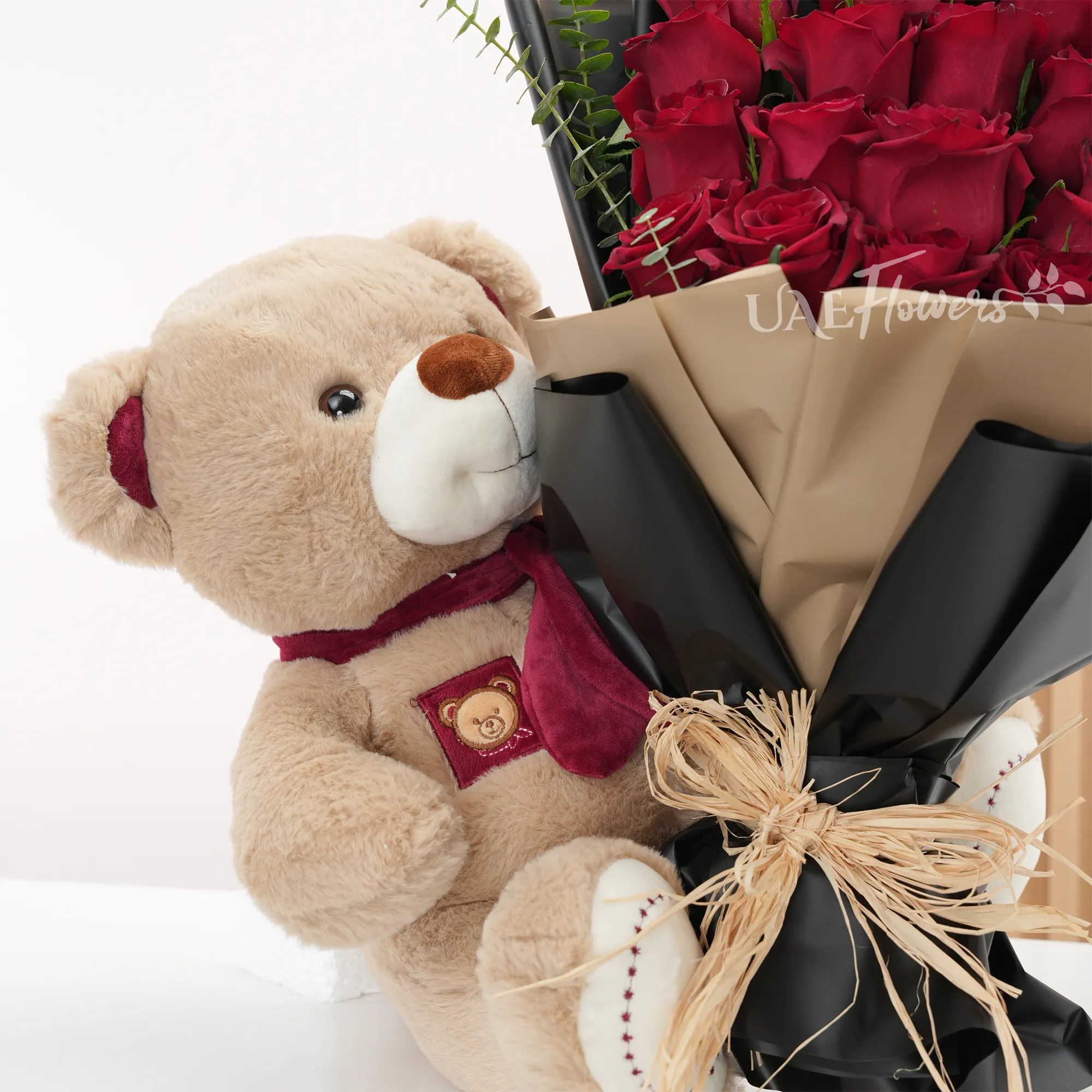 Bouquet of 20 red roses with medium brown teddy bear
